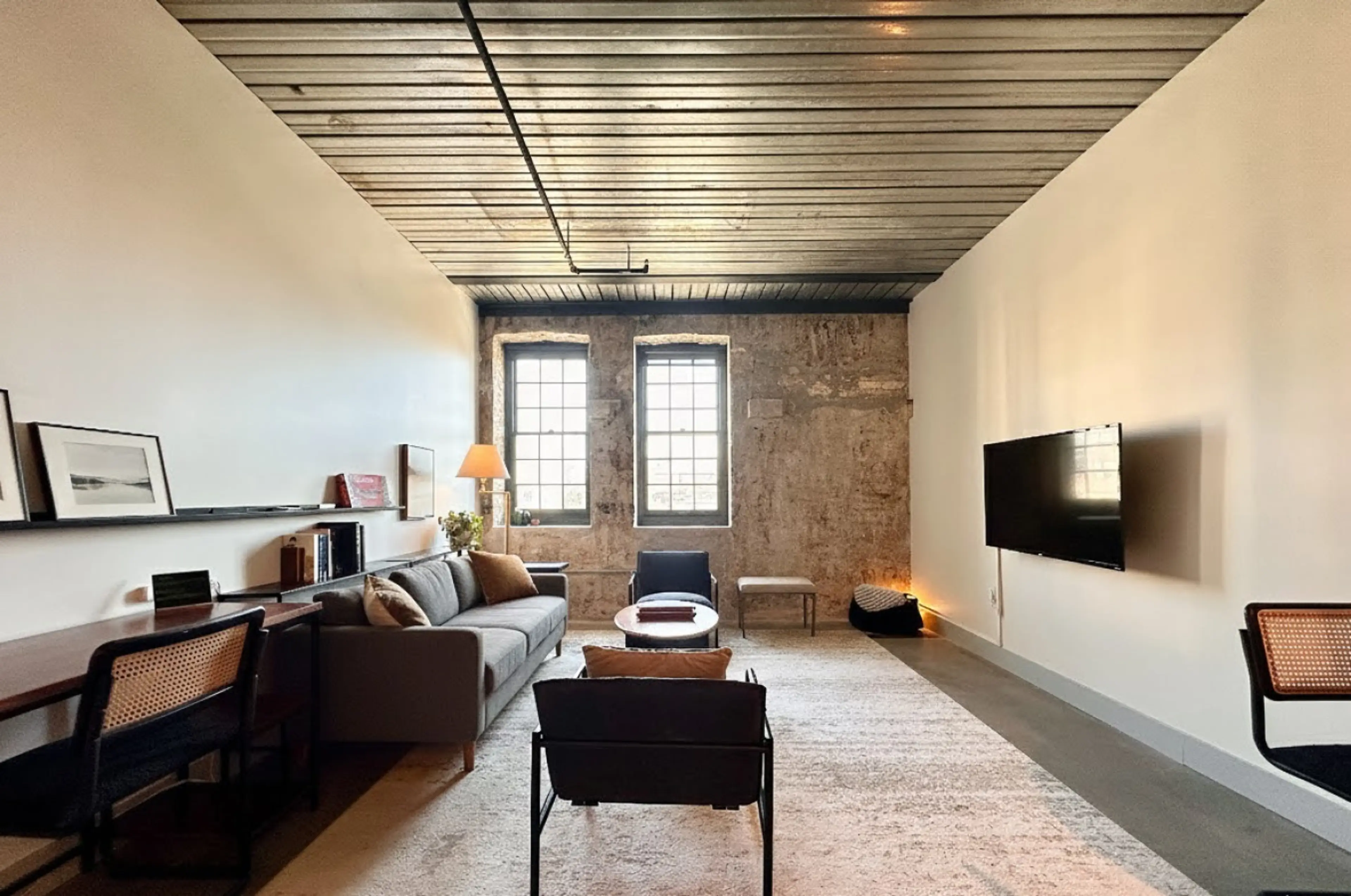 Spacious living room with dedicated workspace and dining table/flex workspace