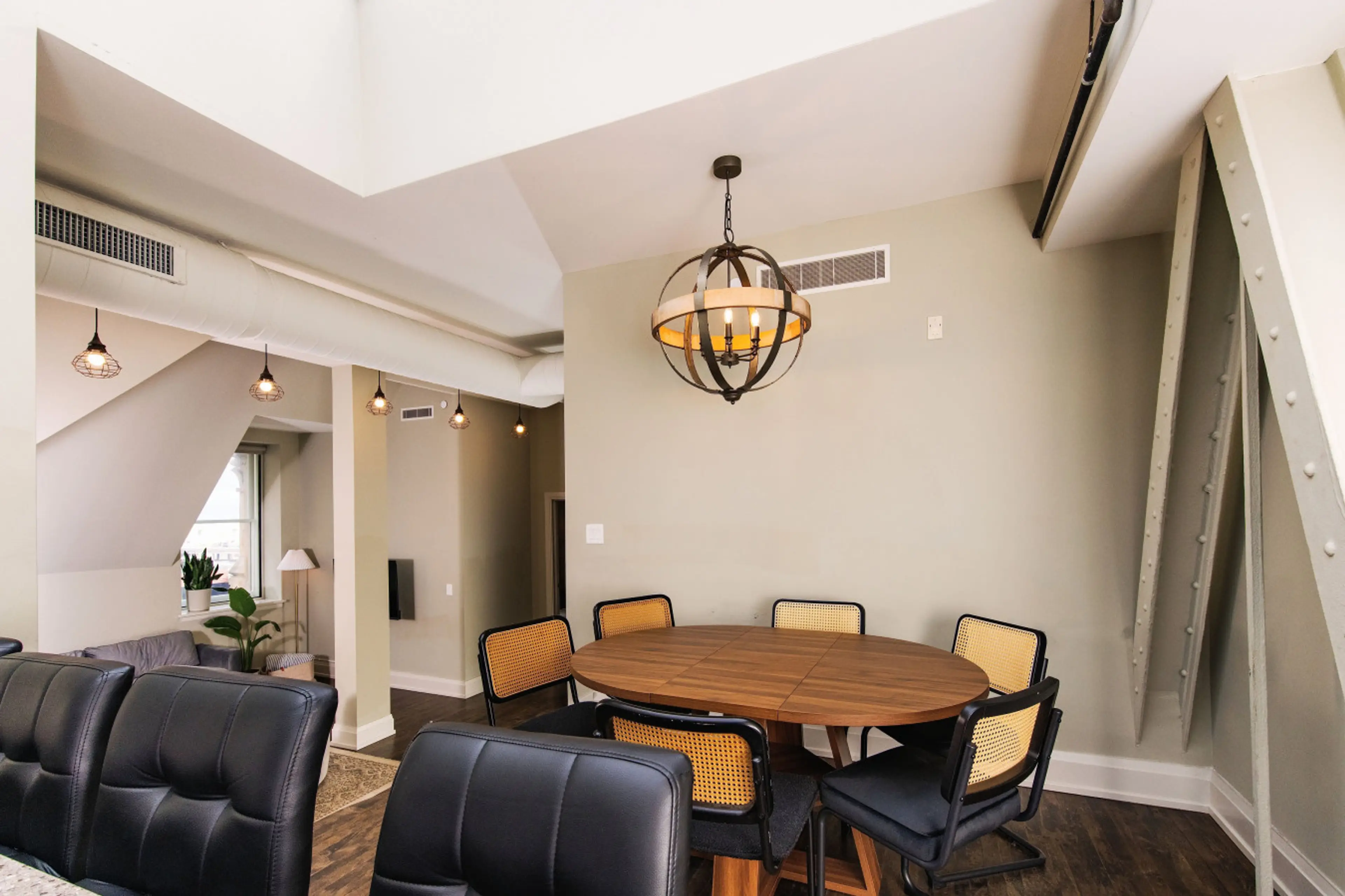 A fully-equipped kitchen featuring high-end finishes, a dining table seating six, and bar seating—everything you need to prep, cook, and refuel