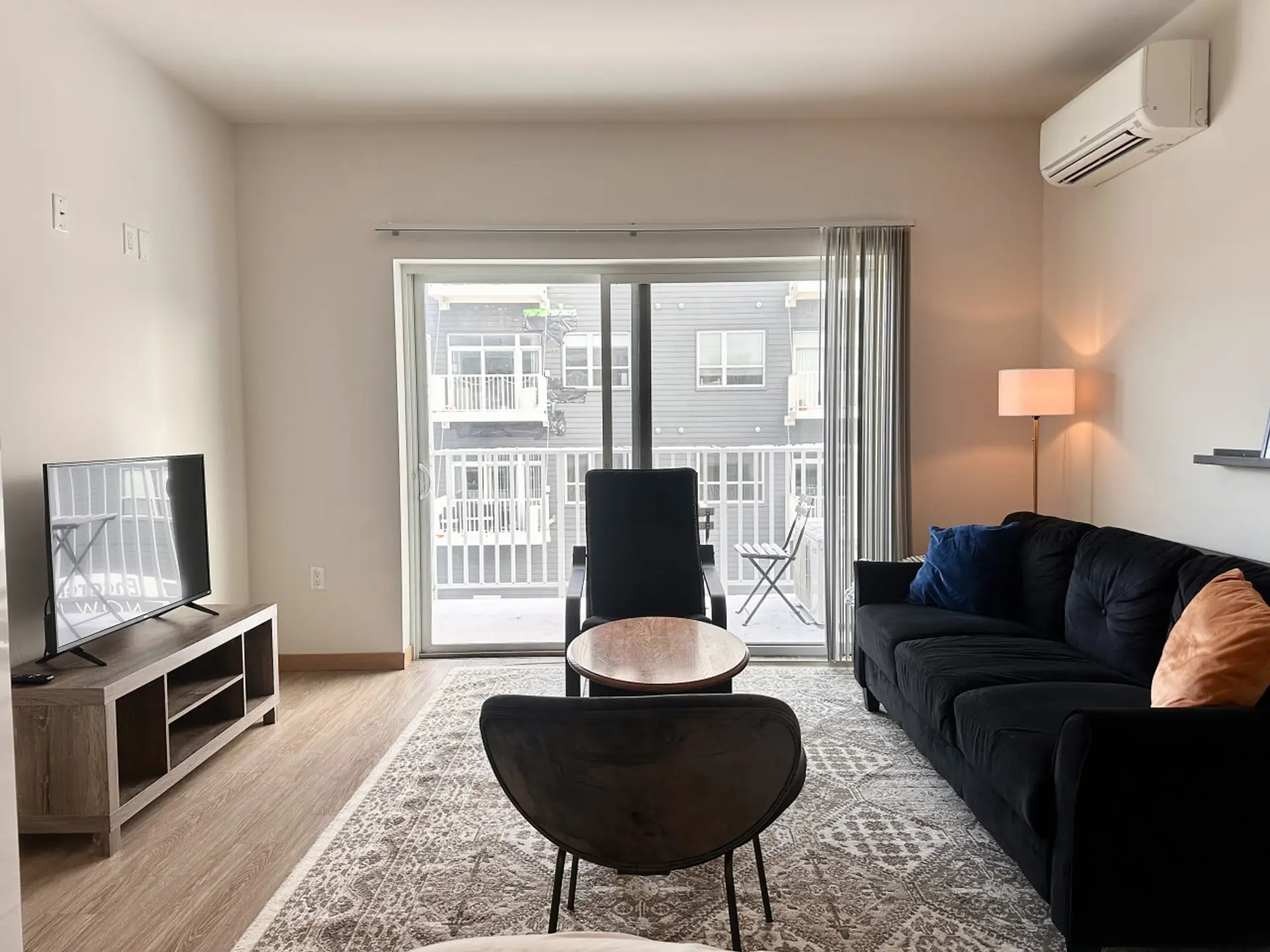 Unwind in the sun-drenched living area, complete with a dining table/workspace and a private balcony for your morning coffee