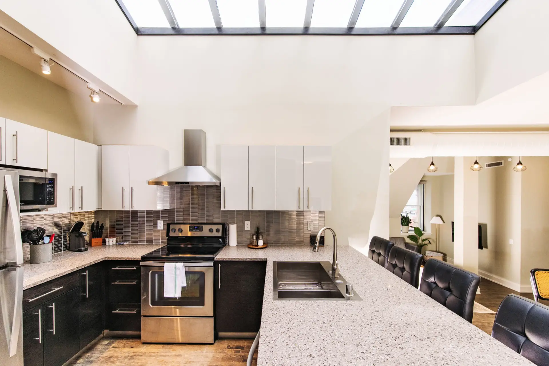 A dramatic skylight floods this penthouse with natural light, offering a unique perspective of the iconic clocktower above