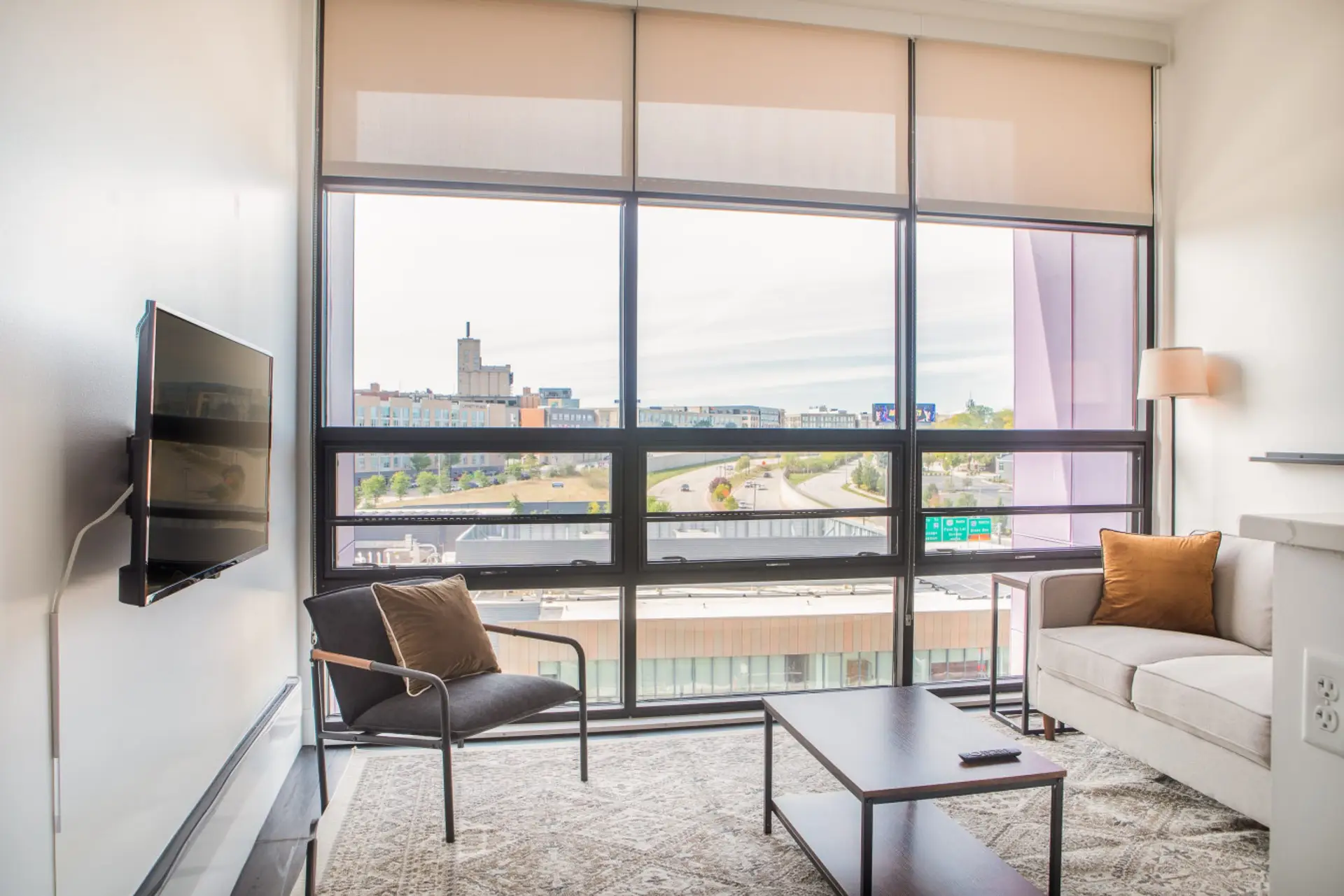 Kick back and relax in the modern living space, featuring flexible seating and a smart TV with built-in Airplay