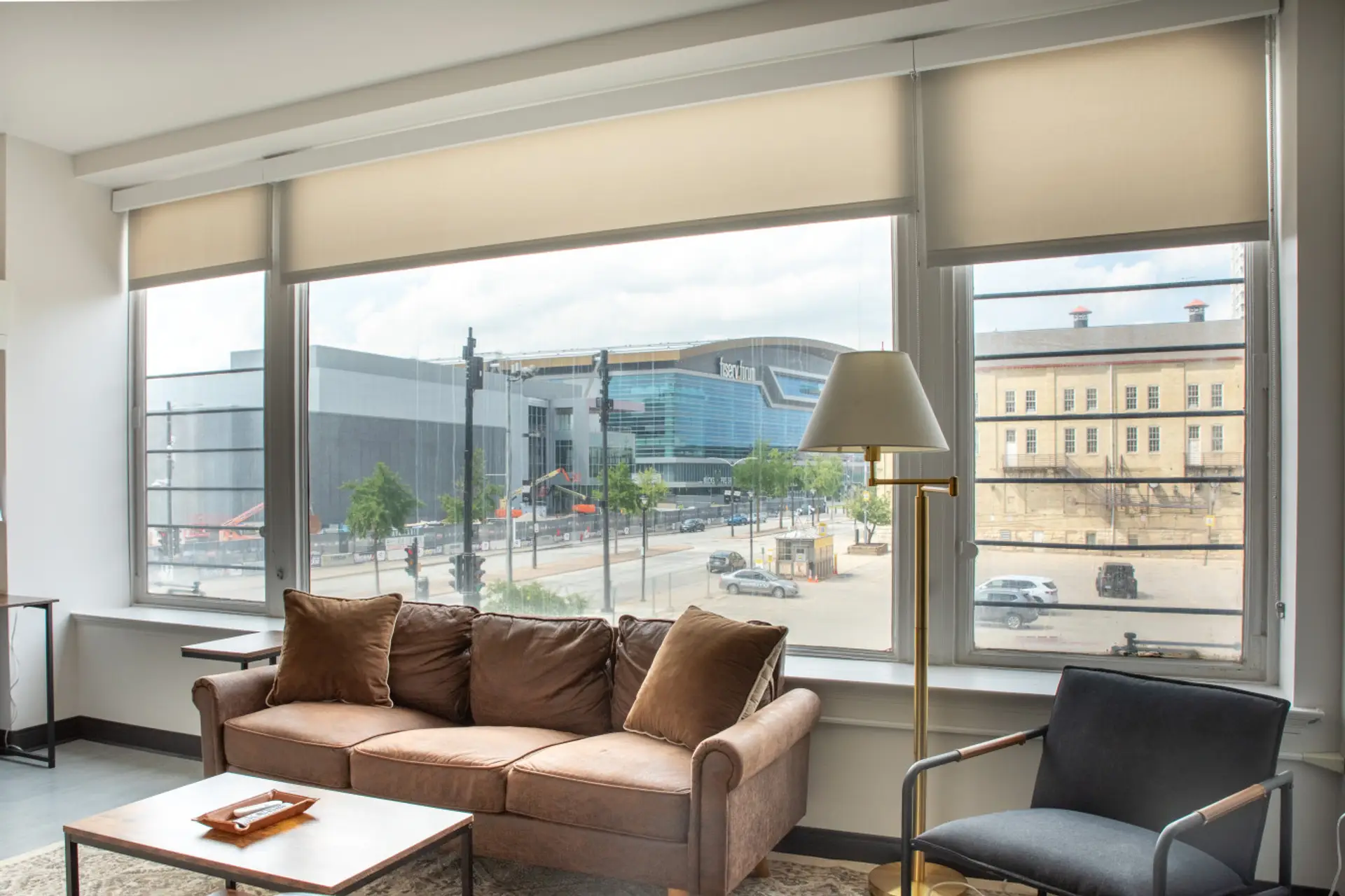 Sun-drenched living area featuring charming architecture and a front-row view of the Fiserv Forum.