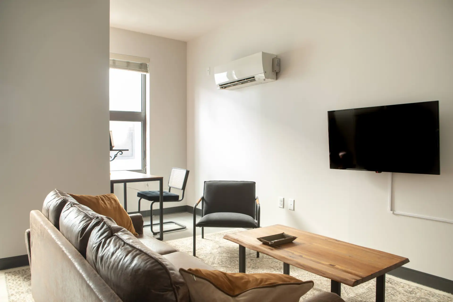 Relax or catch up on emails in this open-concept living space designed for productivity and comfort