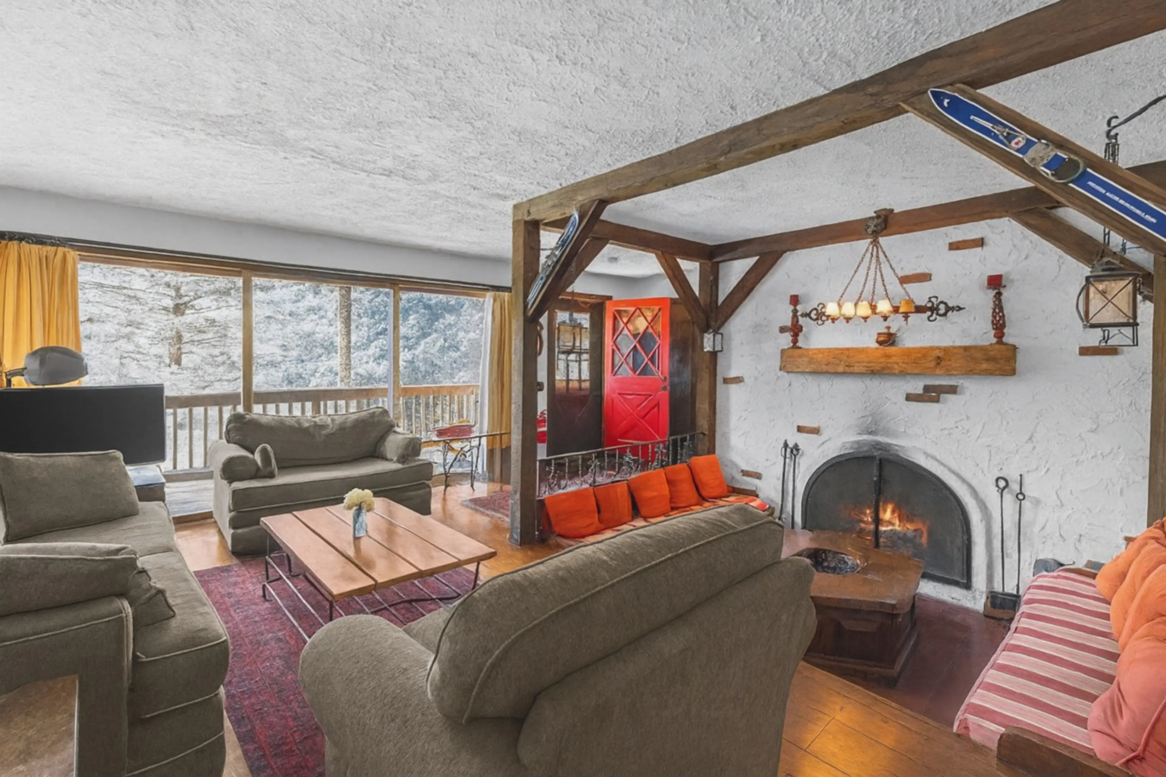 View of cozy den and living room