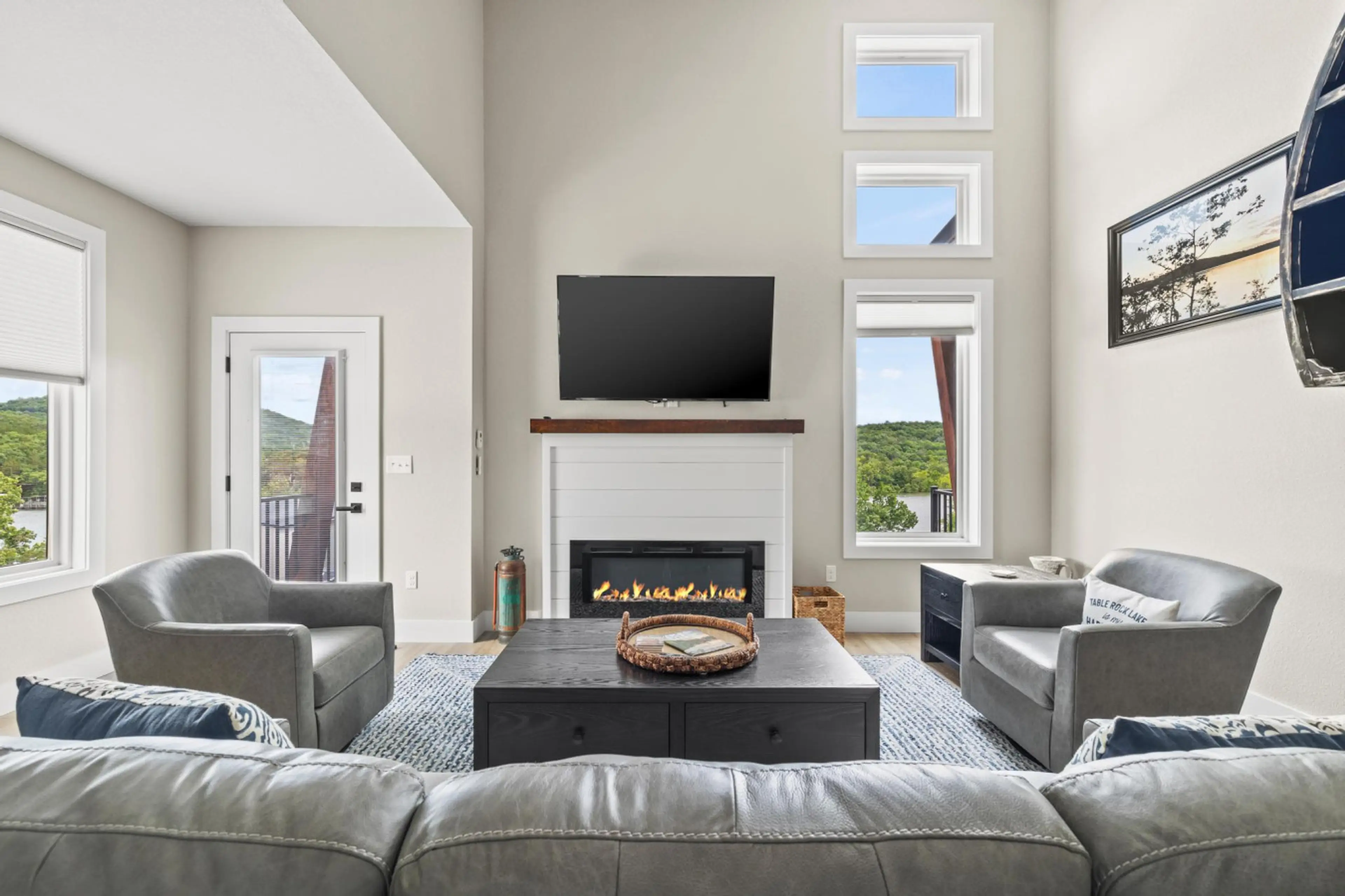 Soaring ceilings, sleek design, and a cozy fireplace create the perfect setting for your lake escape