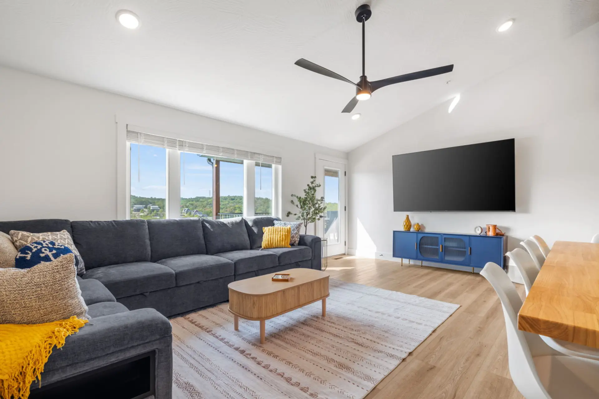Spacious open upstairs living and dining area designed for gathering.