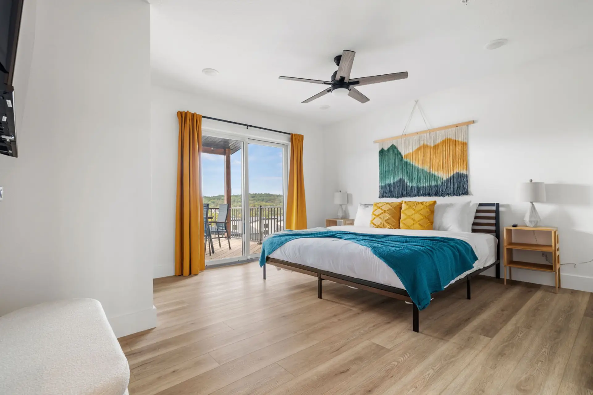Wake up to scenic views in this bright bedroom with balcony access and colorful, modern design.