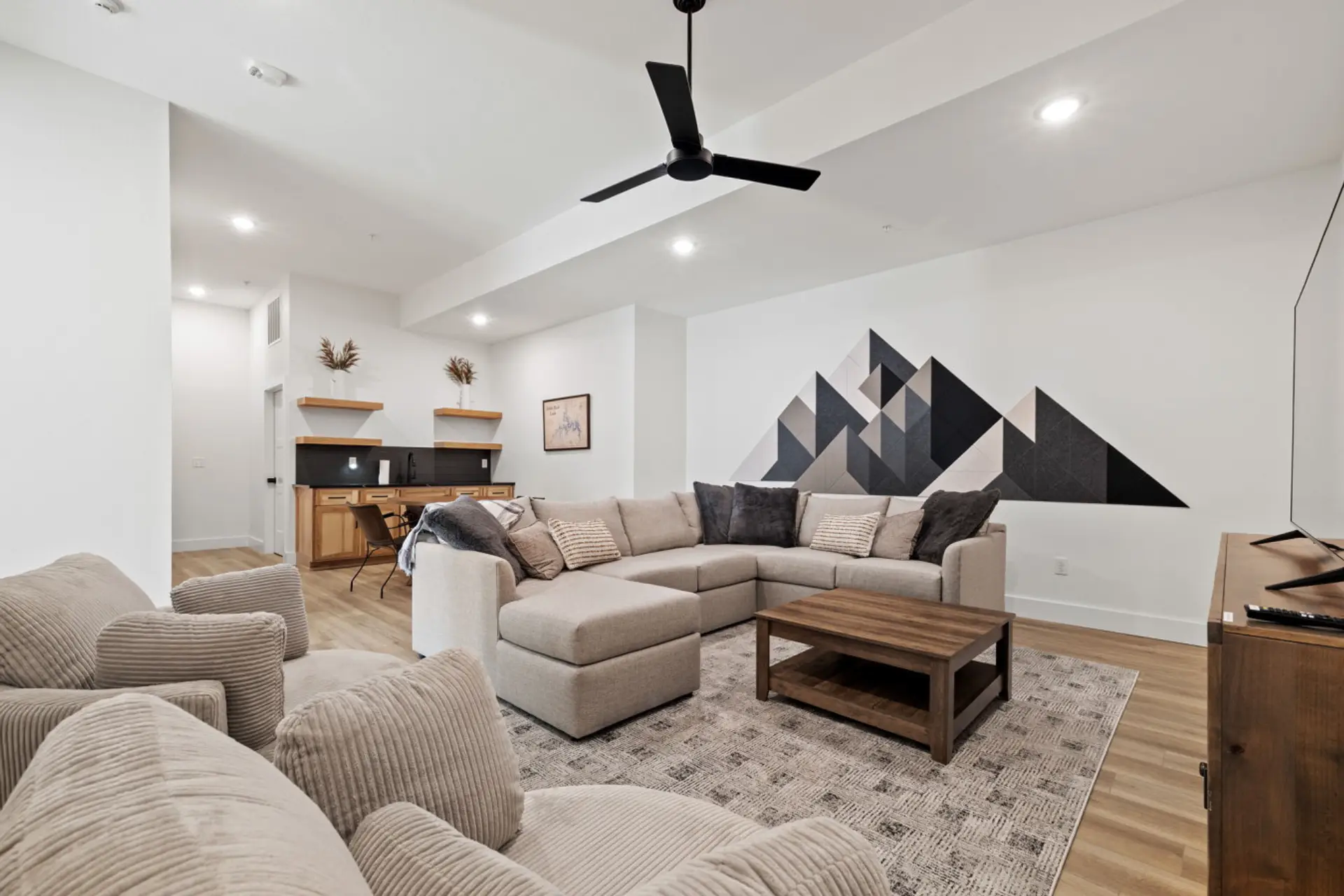 Spacious second living room downstairs, complete with a kitchenette for easy snacks and movie nights.