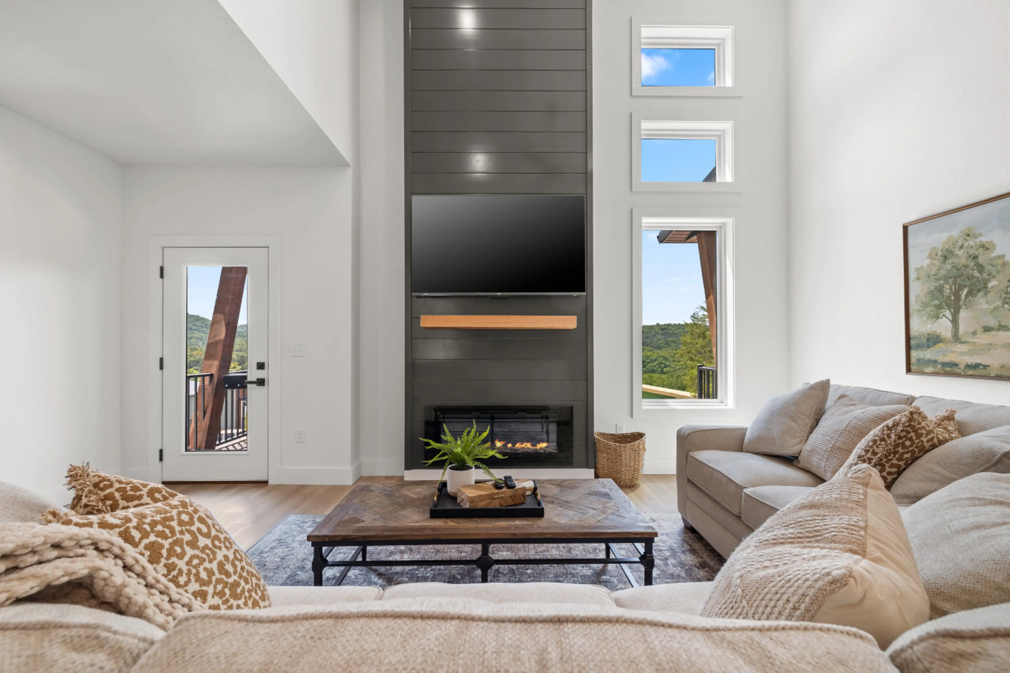 Vaulted ceilings, bright natural light, and a fireplace- perfect for slow mornings or winding down after a full day.