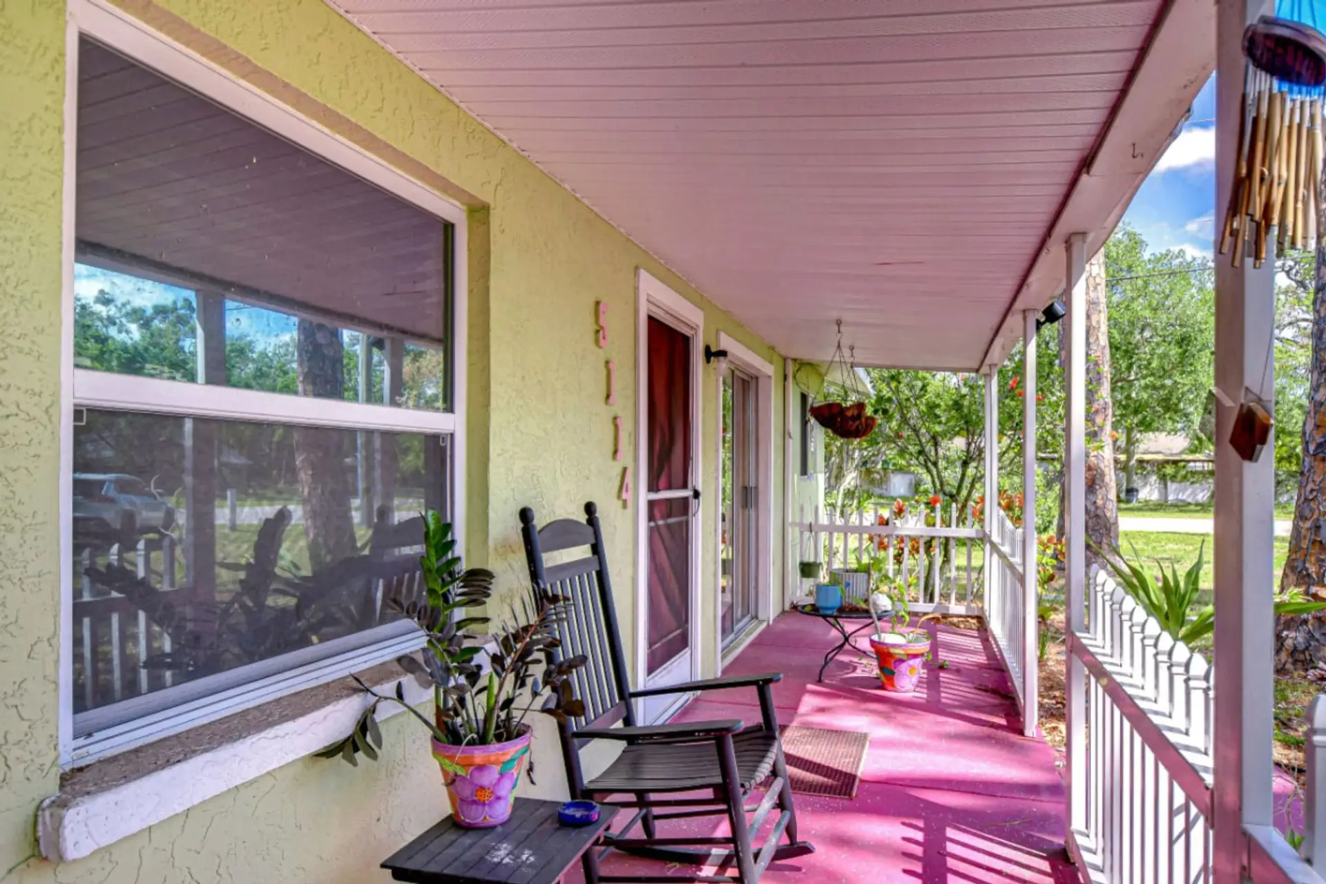 Welcome to the Lazy Manatee - enjoy your private front porch with rocking chairs!
