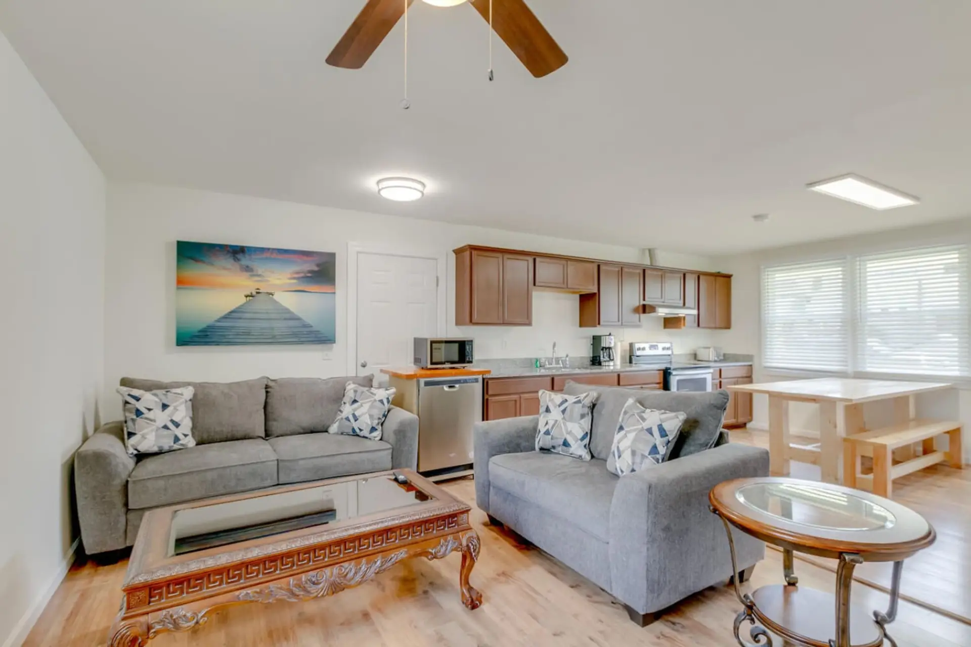 A bright and open living room flows directly into the kitchen, making the whole main floor feel connected.