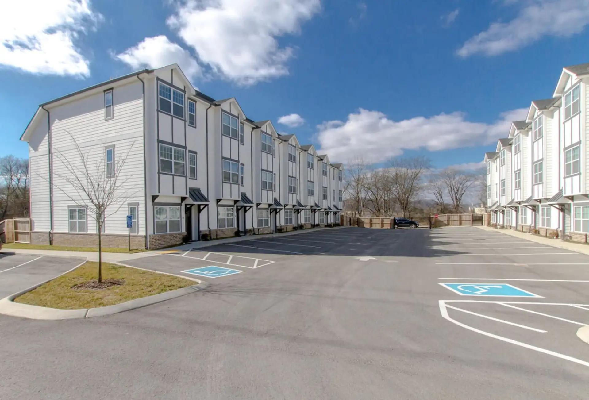 Exterior view of the gated townhome community with private parking