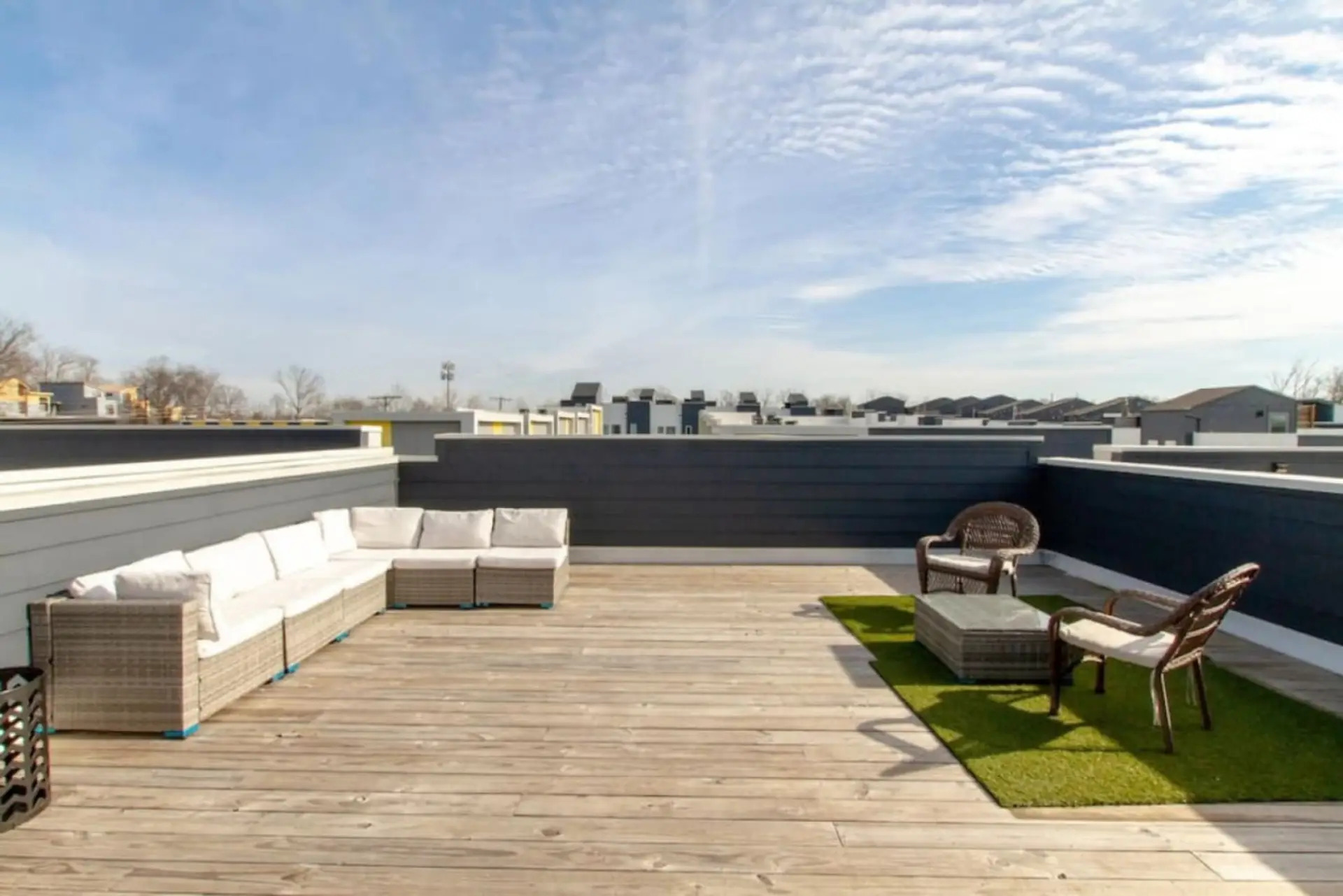The private rooftop deck with comfortable seating offers sweeping East Nashville views at any hour.