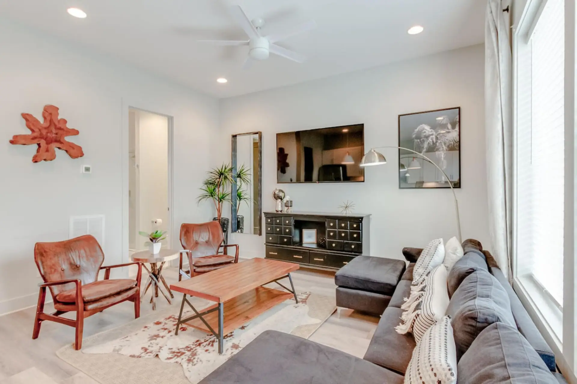 Gather around and enjoy all your favorite shows on the smart TV in this bright and welcoming living room.