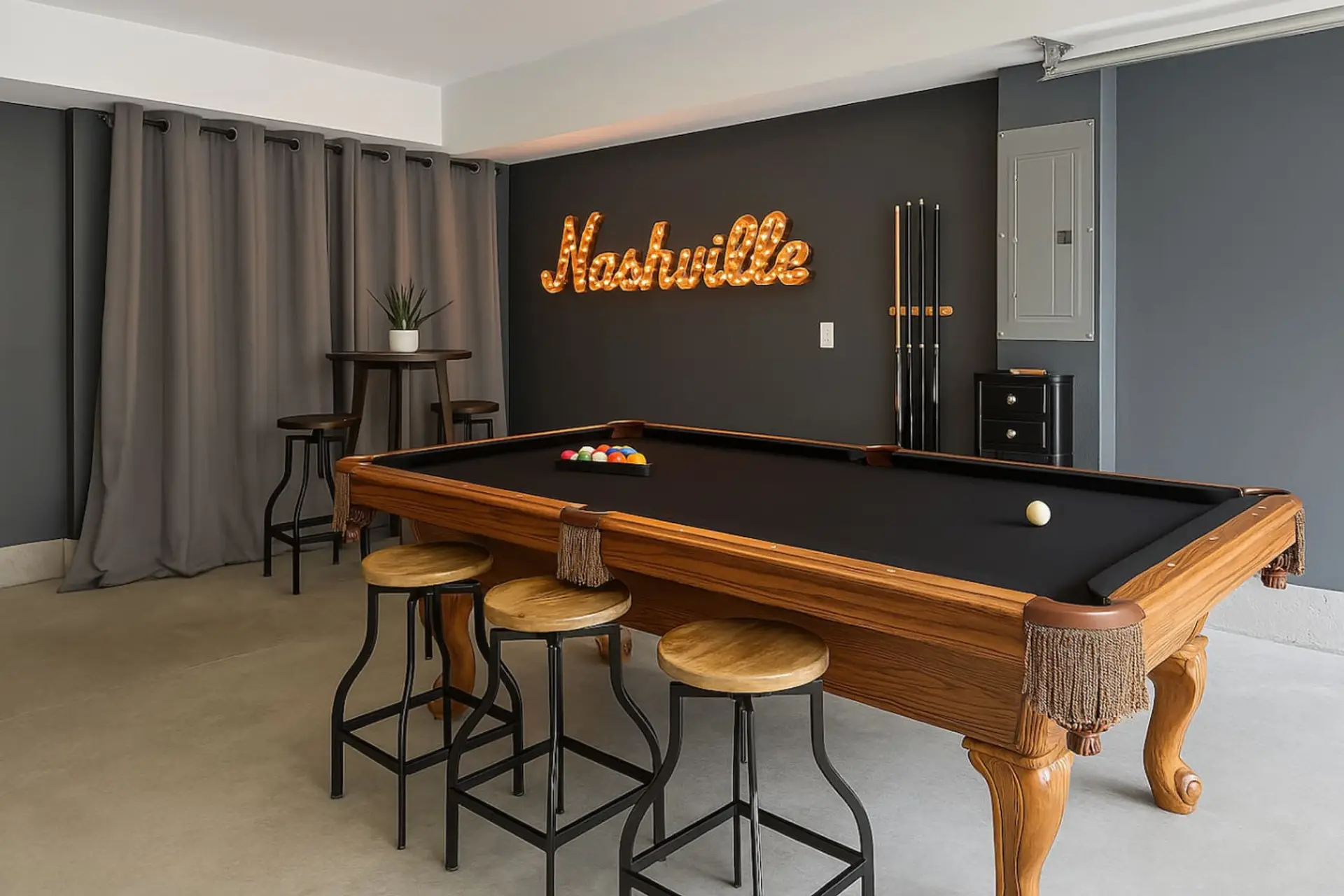 Game room with full-size pool table, bar stools, and glowing Nashville neon marquee sign