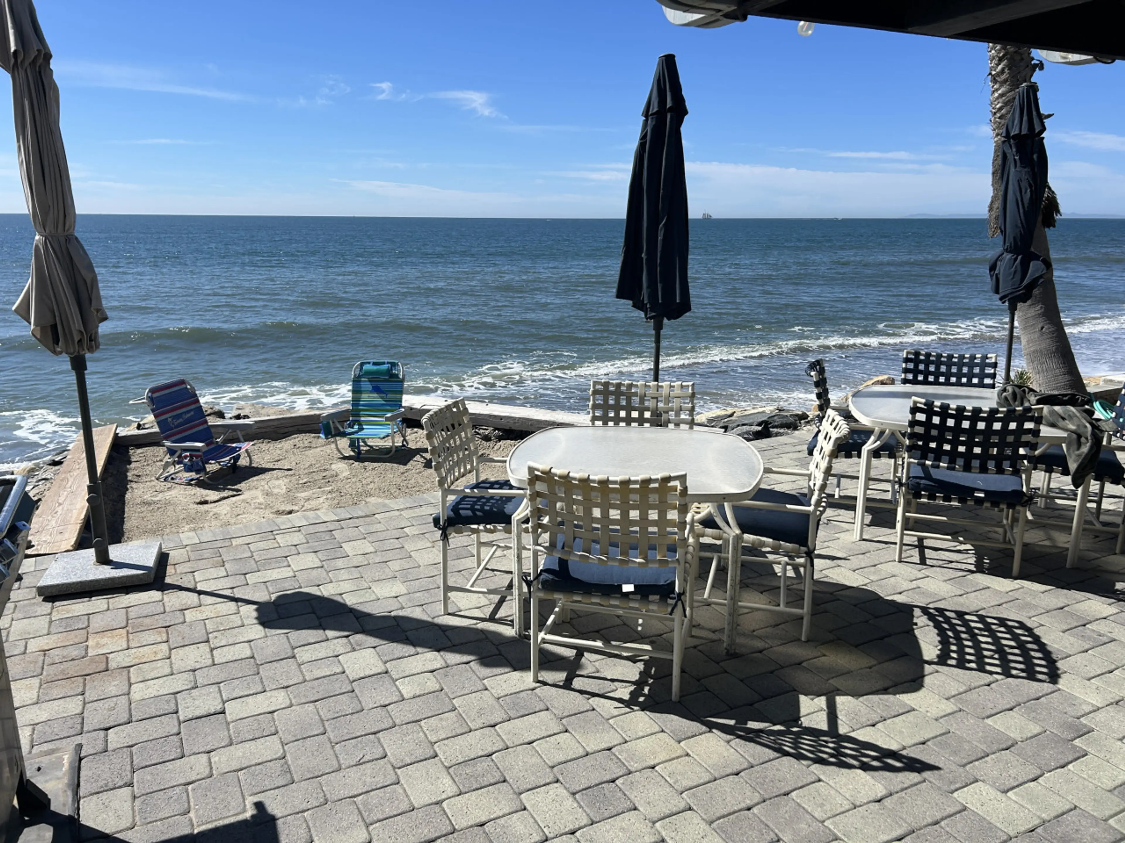 Patio and small beach area at patio level