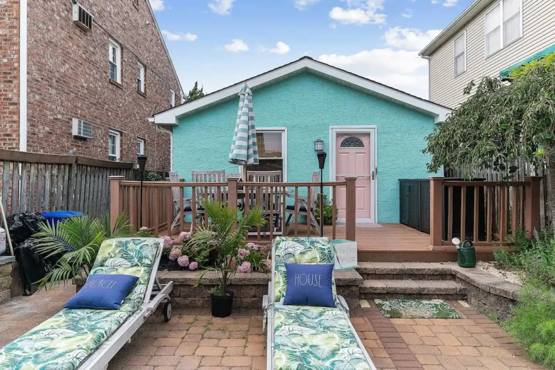 Charming beach cottage with a cozy deck and relaxing outdoor space.