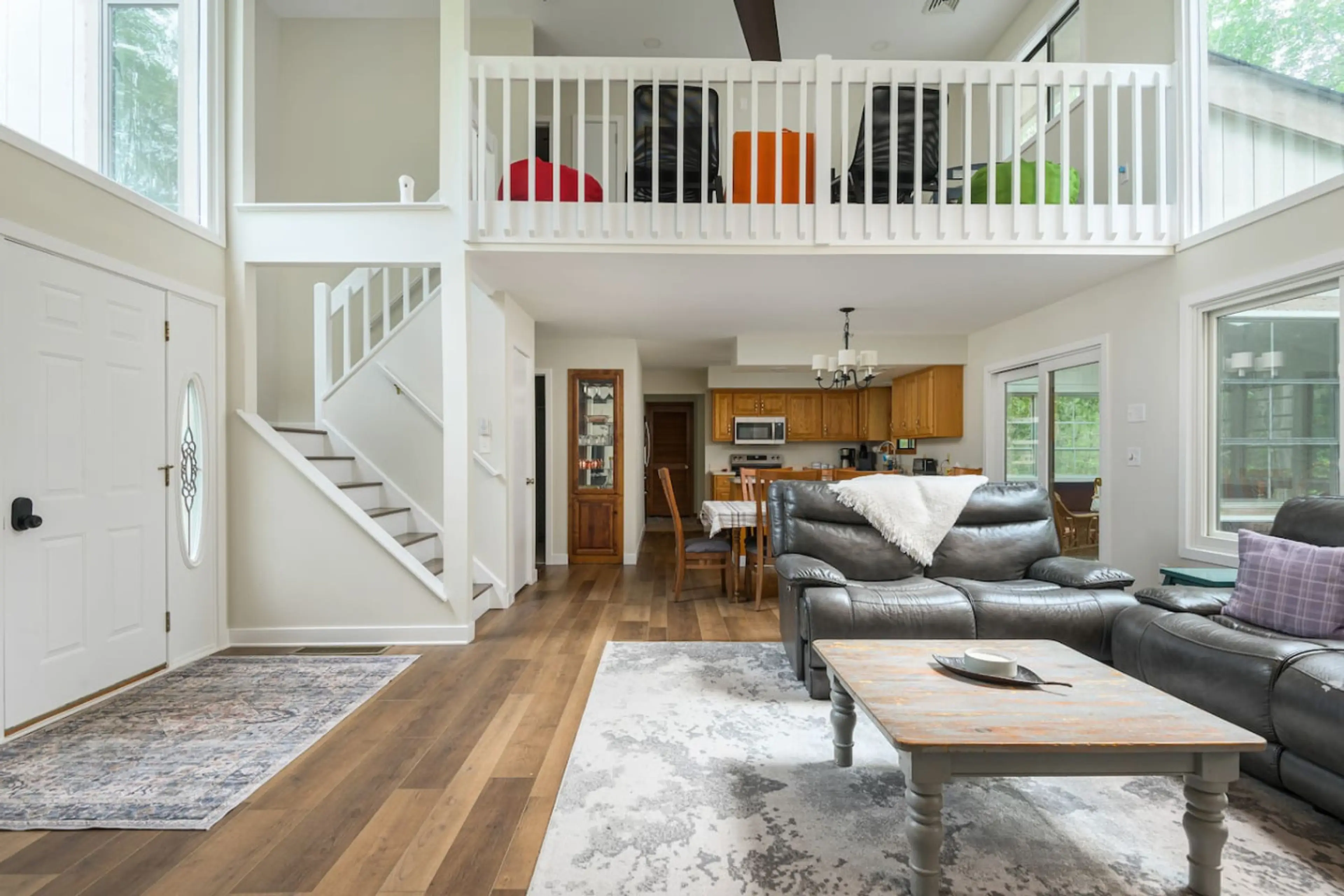 Spacious open-concept living area with cozy seating and natural light