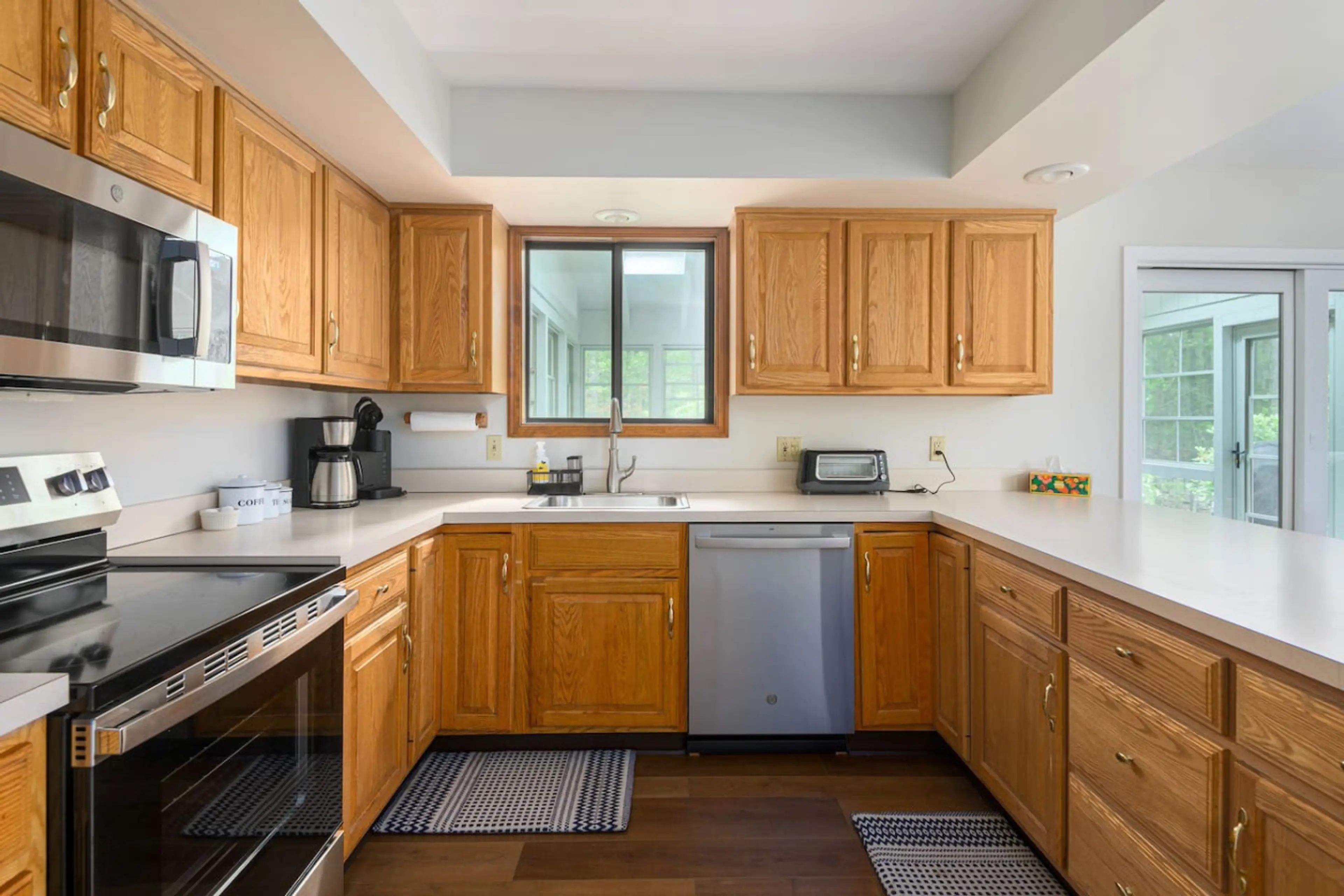 Fully equipped kitchen with ample counter space and modern appliances