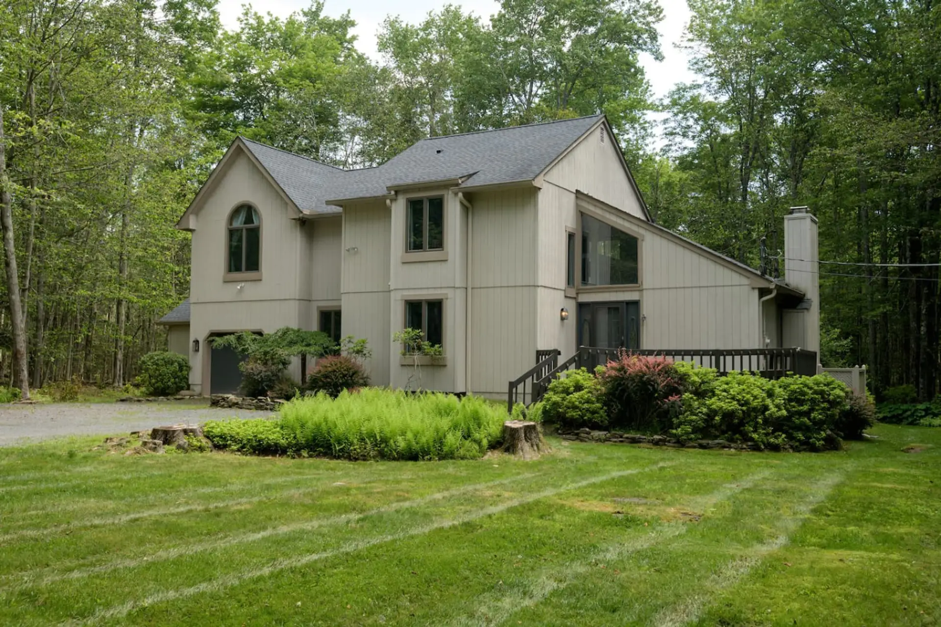 Exterior view highlighting peaceful wooded setting