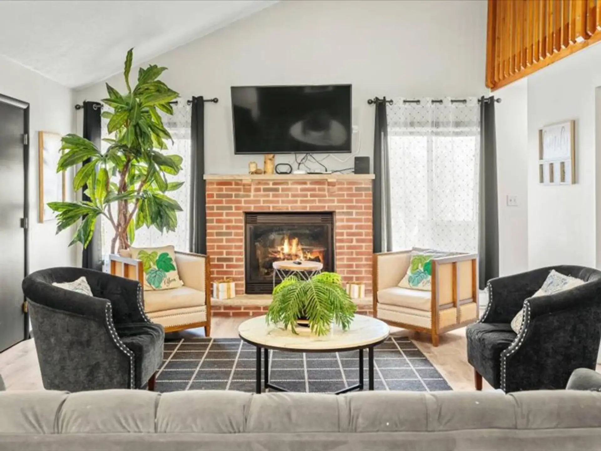 Cozy up beneath cathedral ceilings in a space made for laughter, lounging, and late-night fireside chats