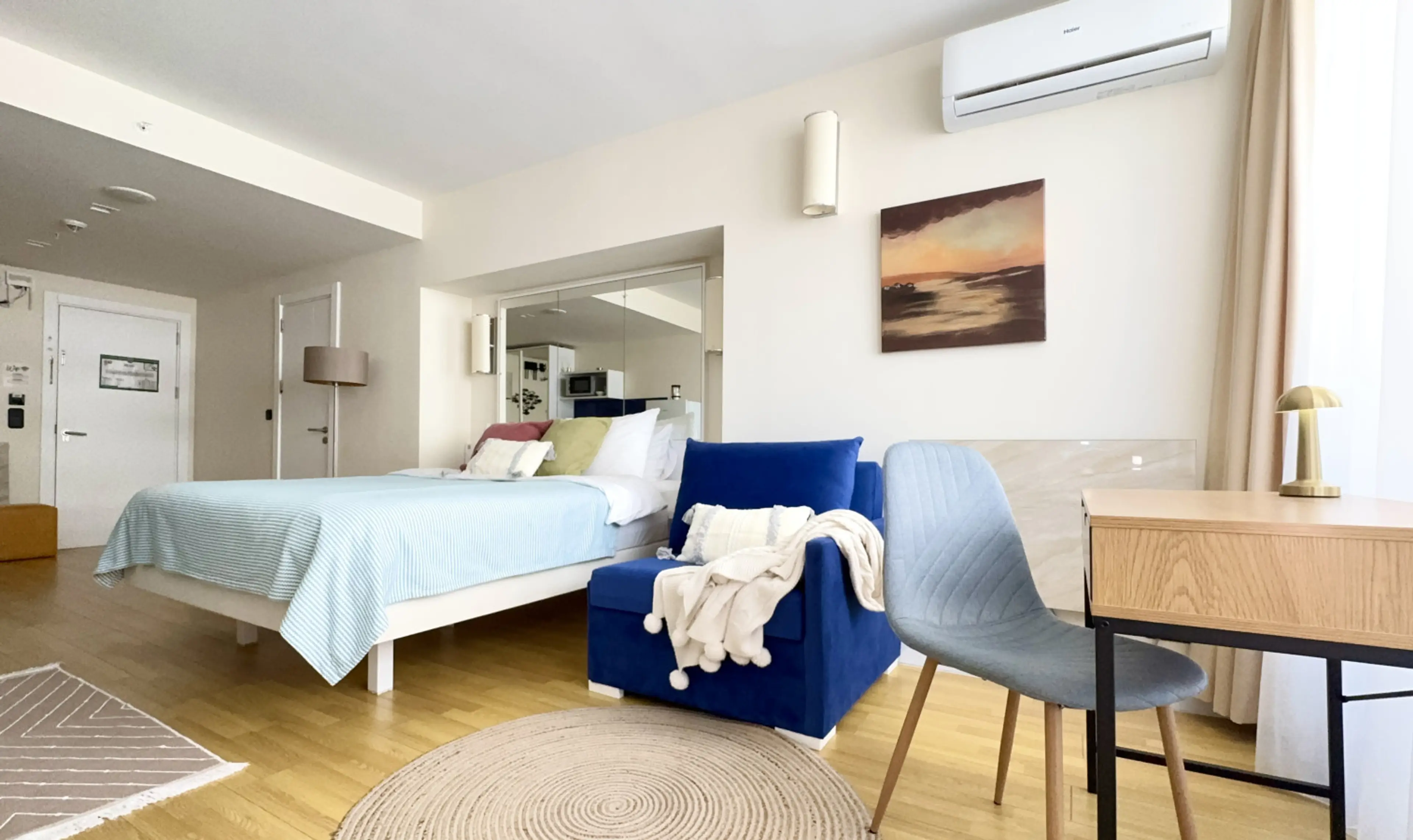 Bright studio with lounge, desk, and spacious bed — perfect comfort for your Batumi stay.