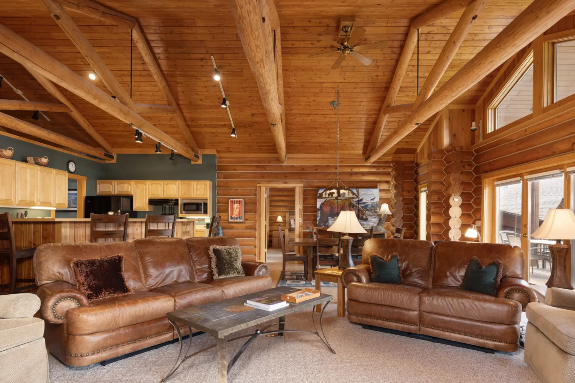 Spacious living room with vaulted ceiling and with  beautiful views to the outside.
