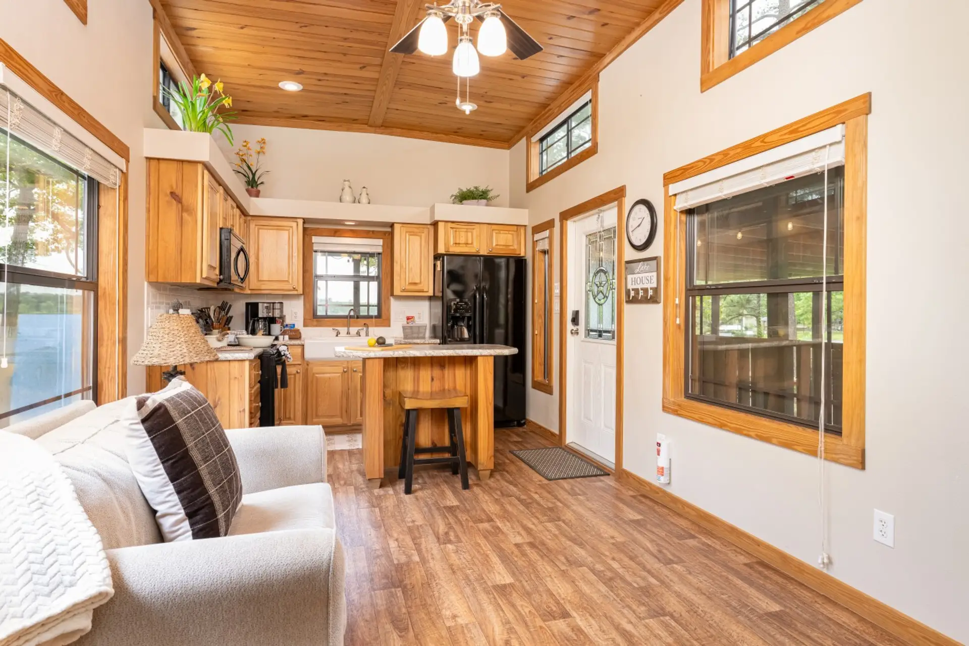 Living room & island kitchen with high ceilings