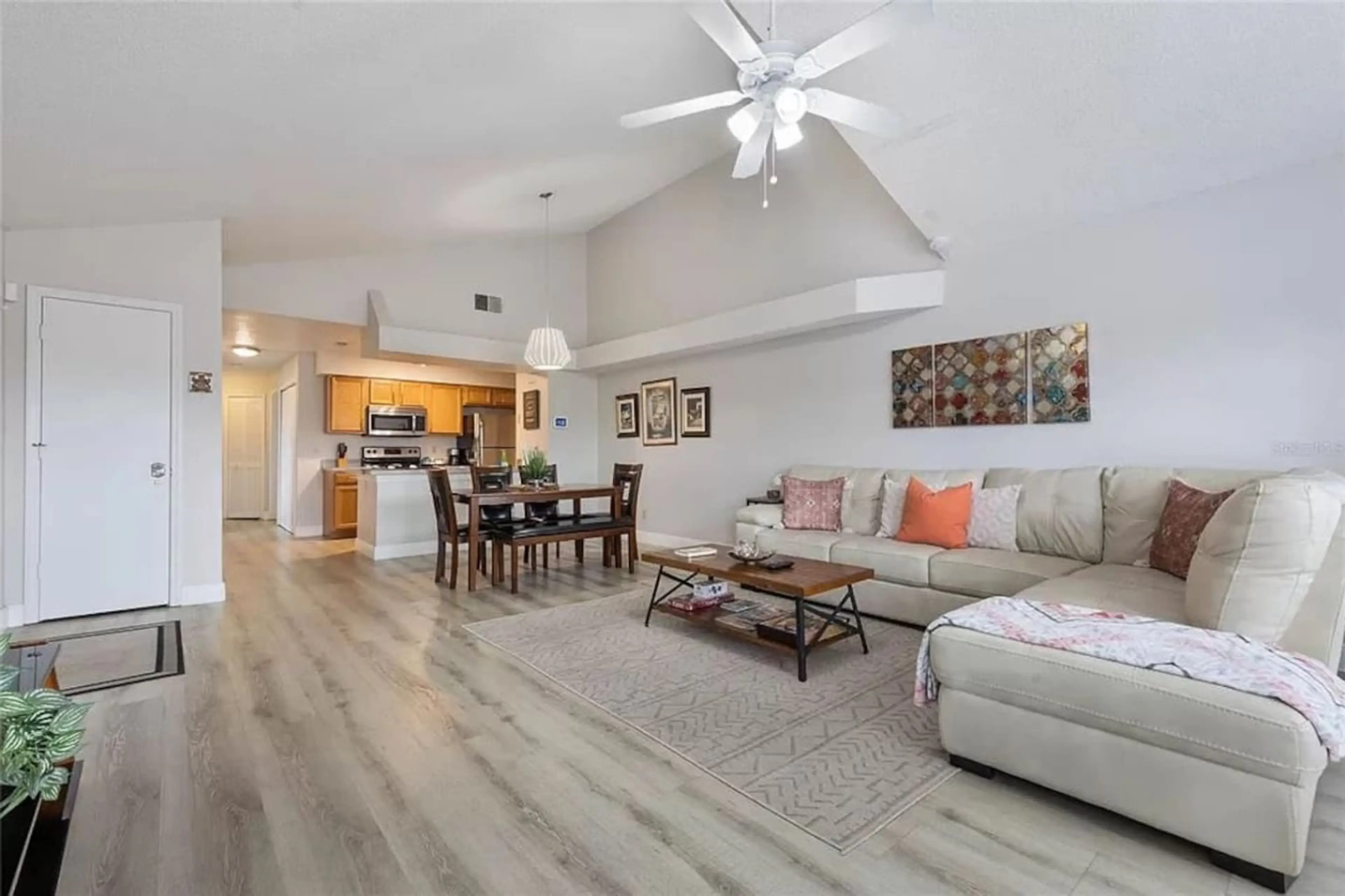 Spacious and cozy living area with comfy seating and a smart TV, perfect for movie nights or winding down after a theme park day.