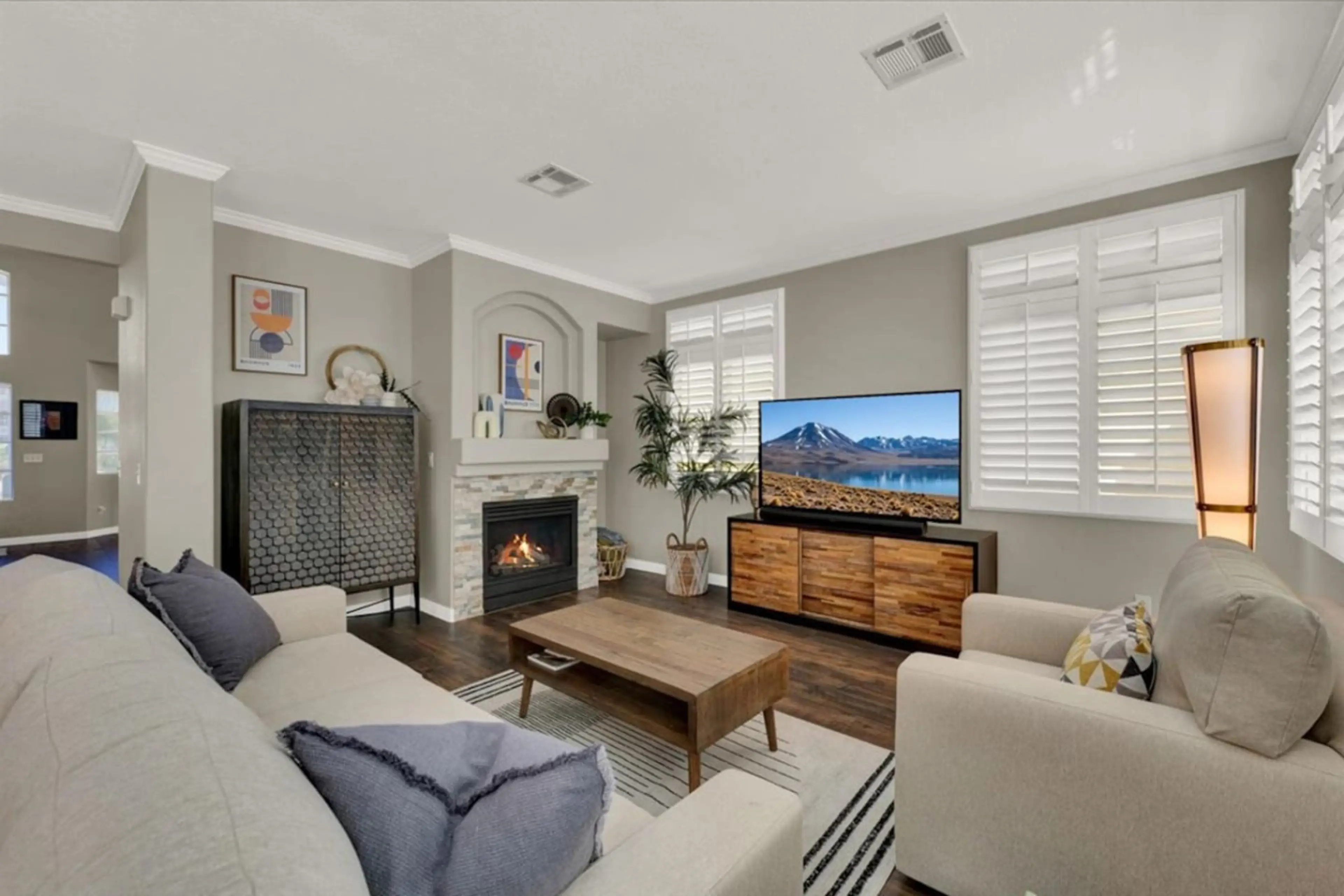 Relax in the spacious living room with cozy seating and a smart TV for streaming your favorite shows.