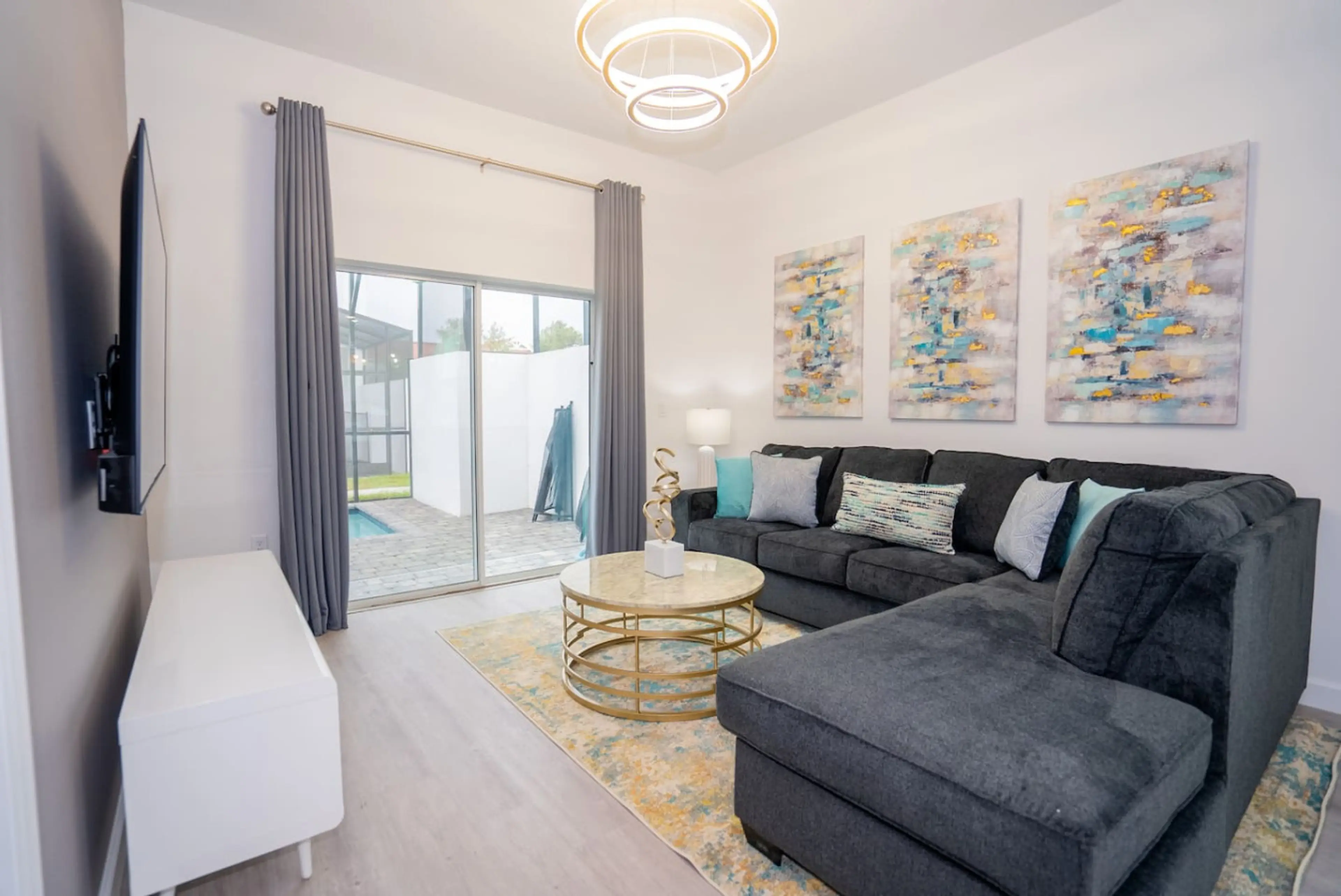 Bright and spacious living room with cozy seating and Smart TV entertainment.