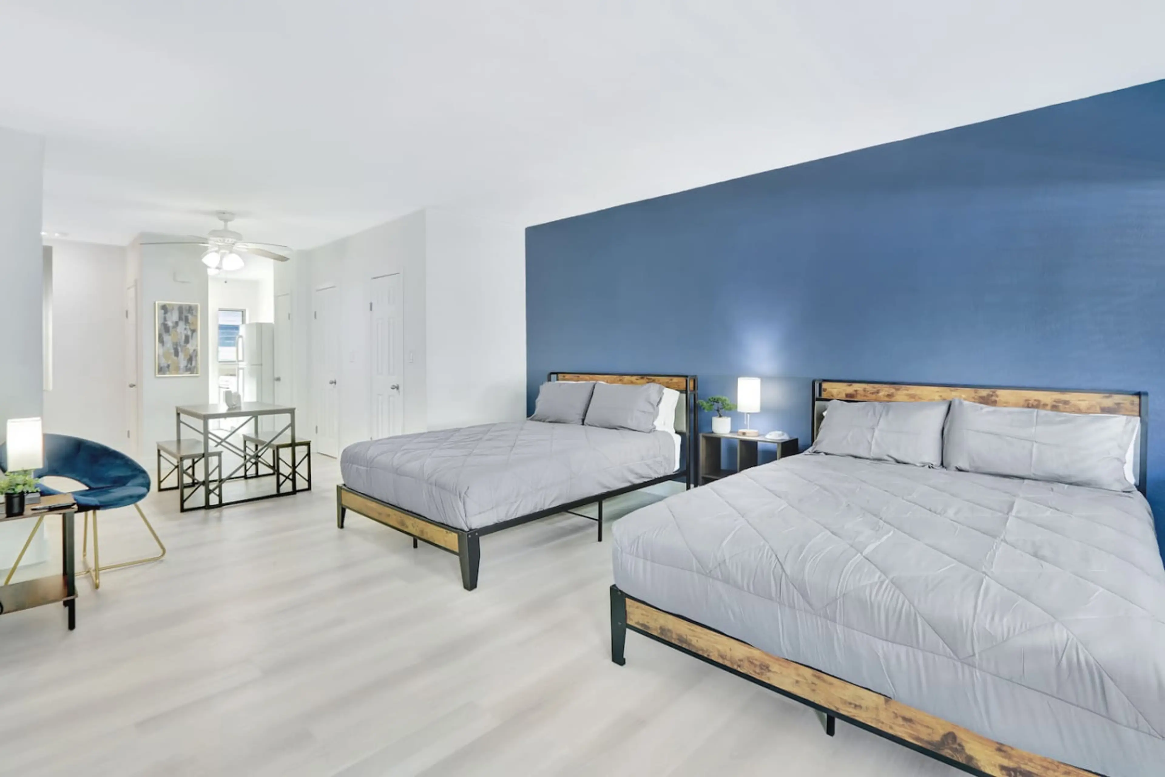 Bright and inviting space with two cozy queen beds, comfy seating, and a Smart TV for streaming your favorites.