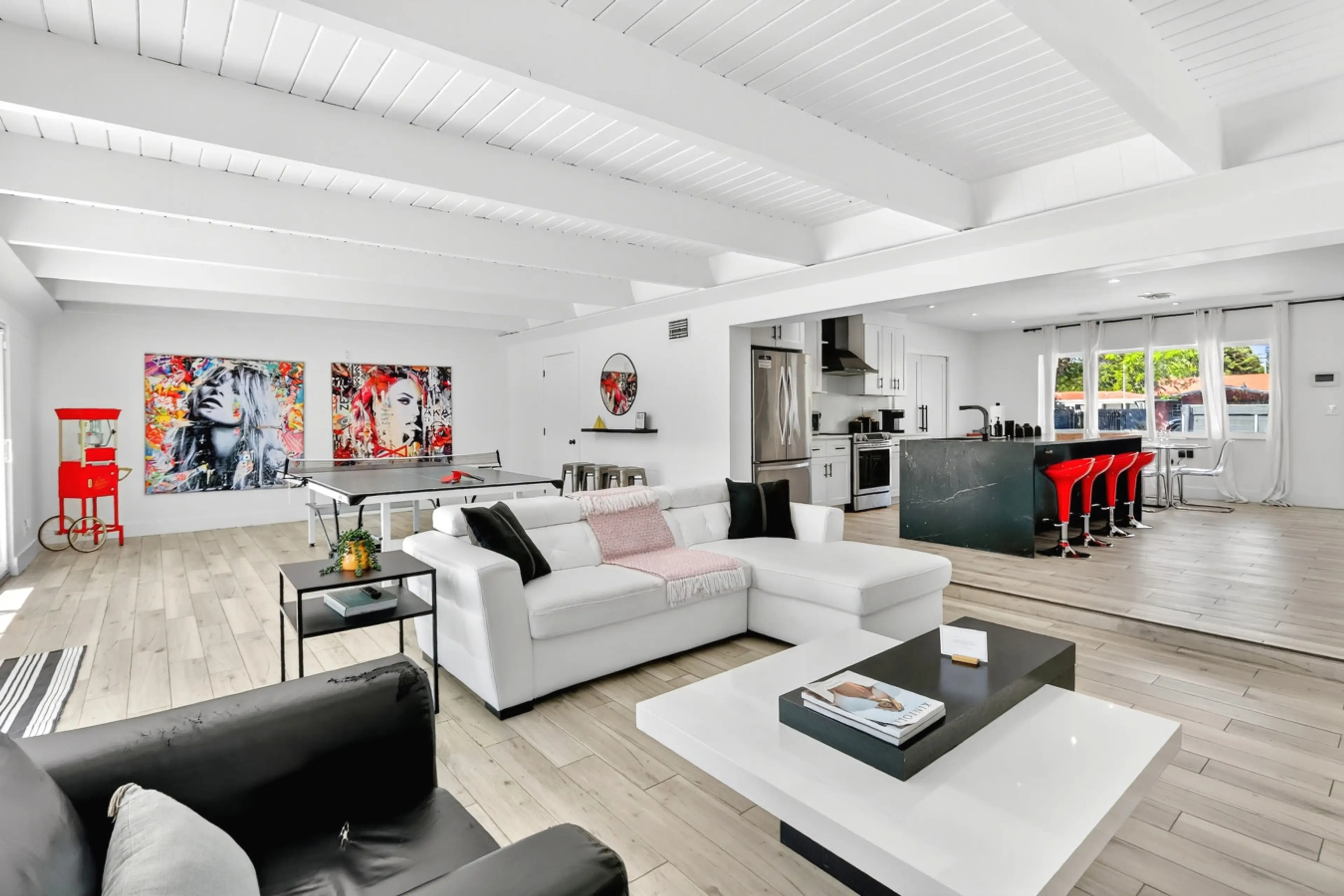 Relax in the bright living room with comfortable seating and a smart TV.