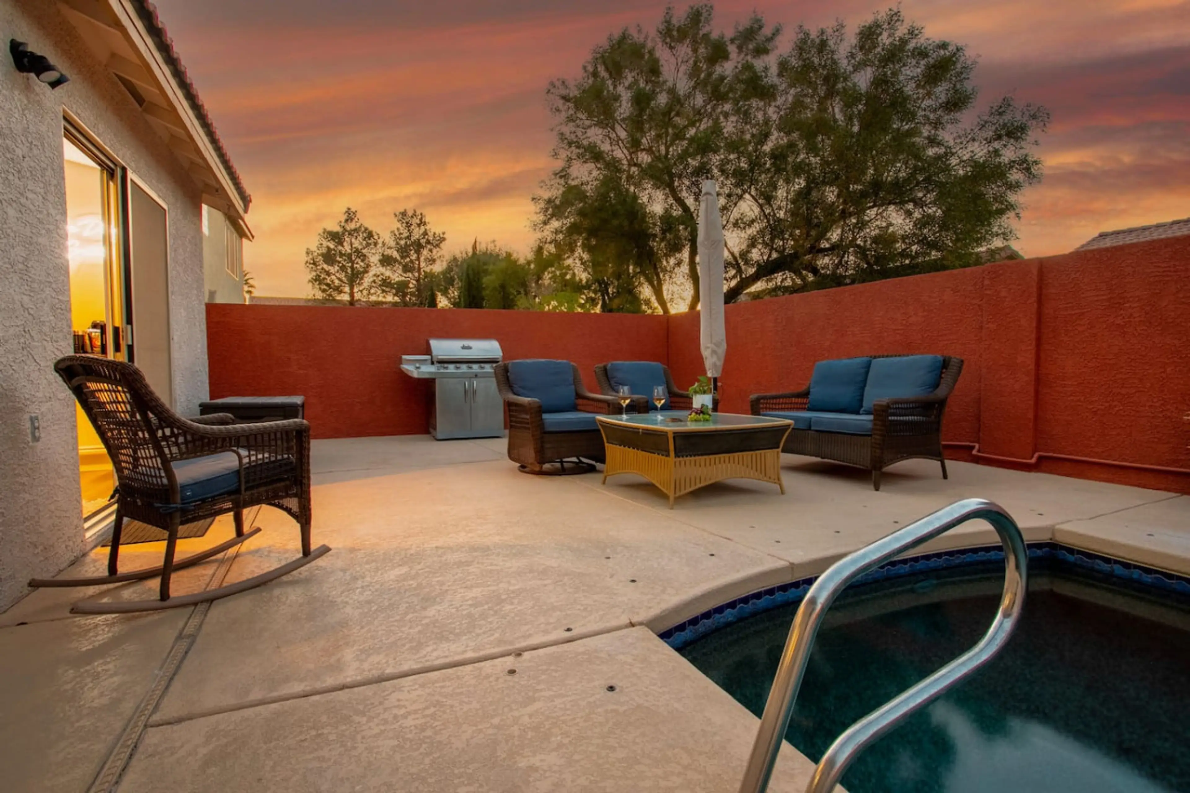 Private outdoor space with heated pool, sun loungers, and BBQ for outdoor cooking.