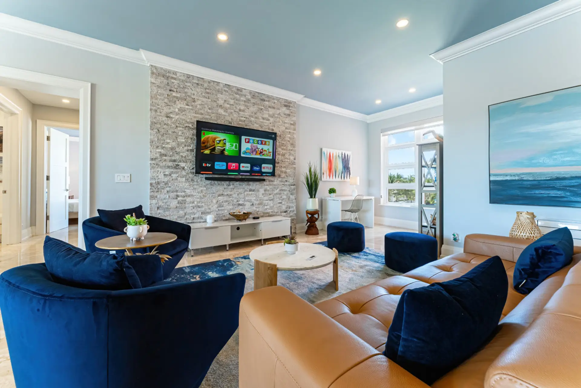 Bright & spacious living space w/ smart TV, Apple HomePods & sofa pulls out into a queen bed!