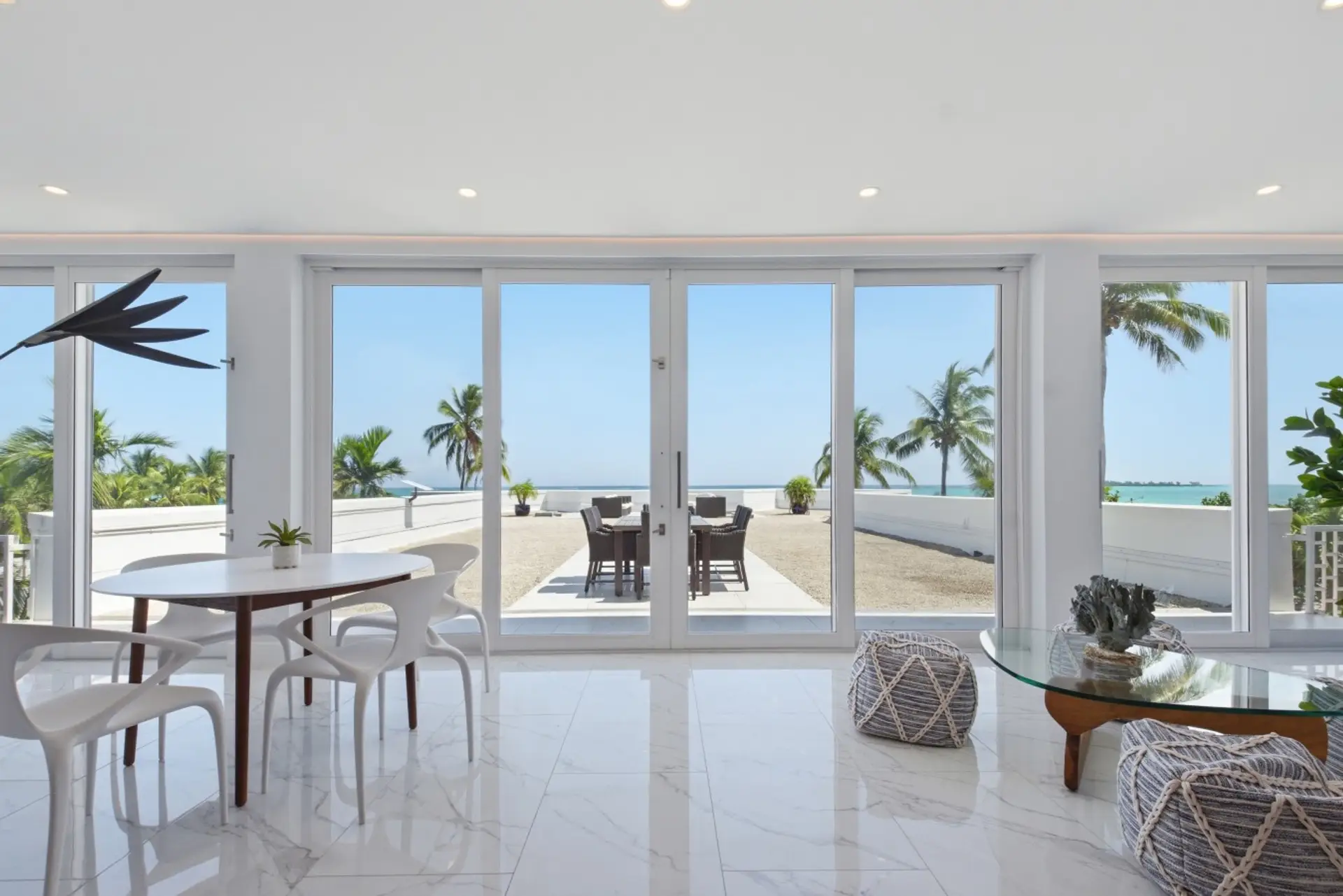 Laid-back luxury meets coastal comfort in this sleek, open-concept design, boasting an spectacular 3,400 sq. ft. terrace directly on the ocean.