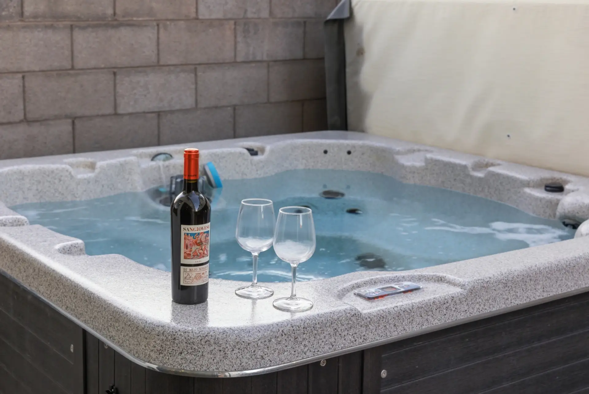 Outdoor Oasis: Unwind in the bubbling hot tub with wine and starry skies above!