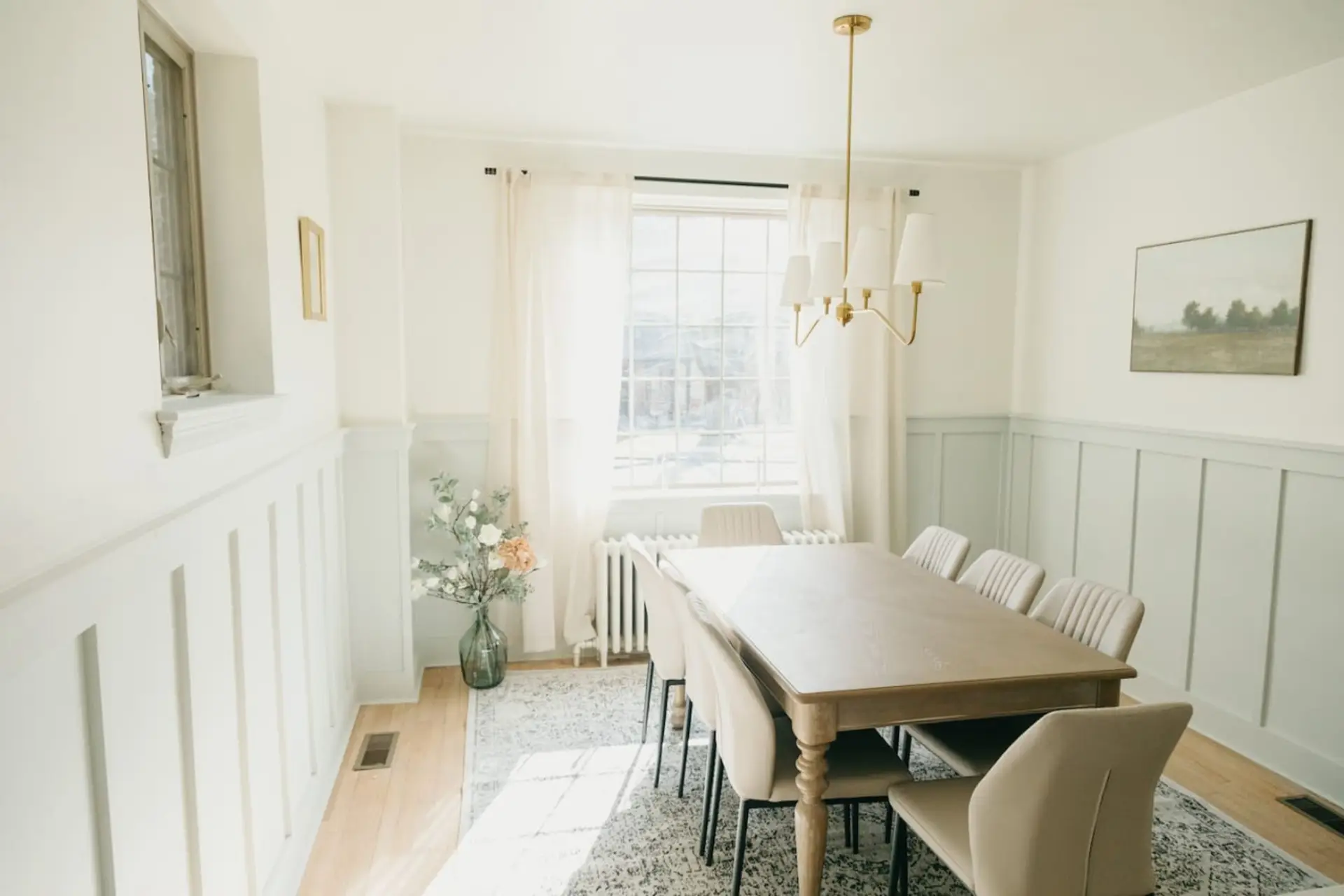 Elegant dining room with wooden table, and chandelier