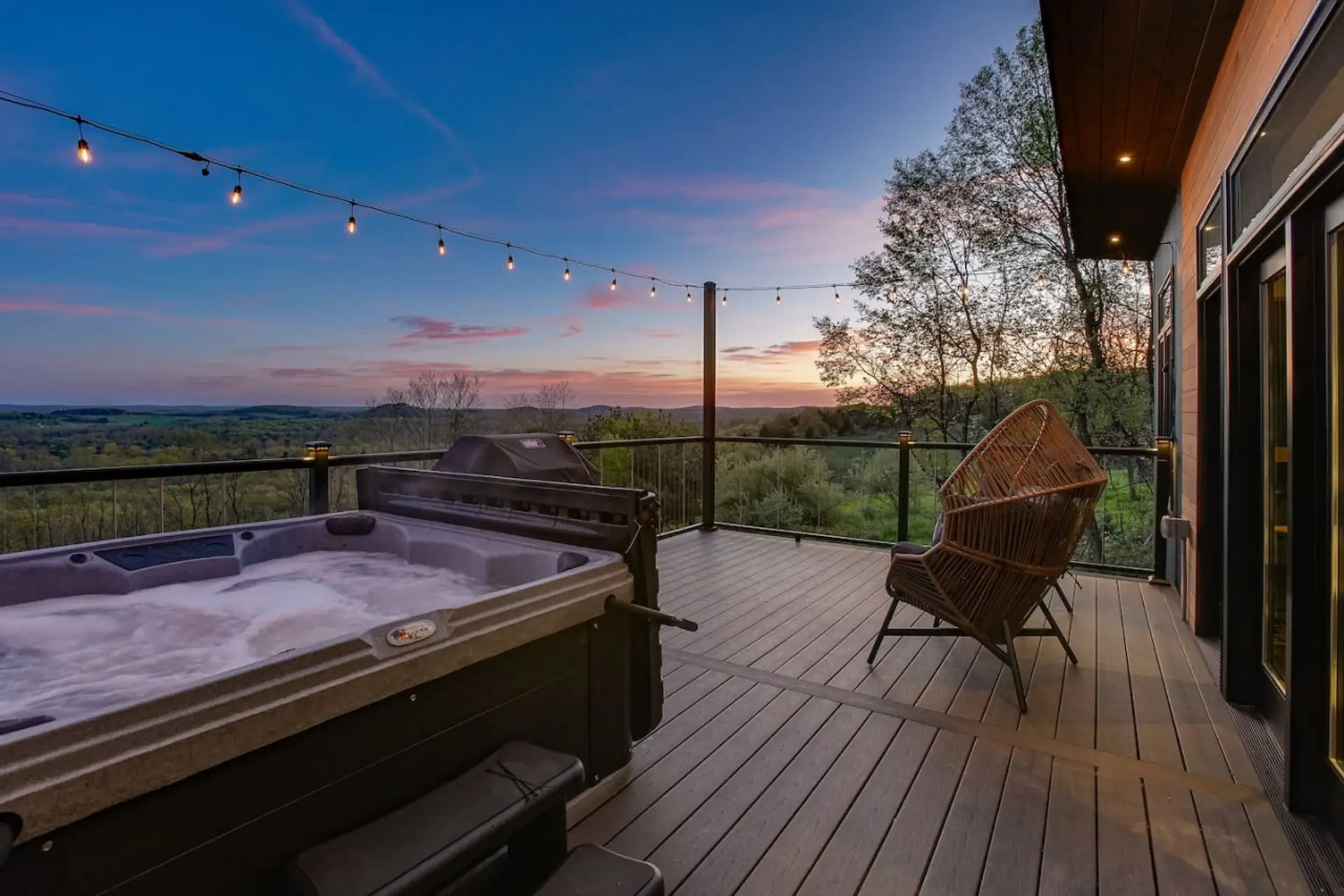 Outdoor hot tub with a seating and scenic view
