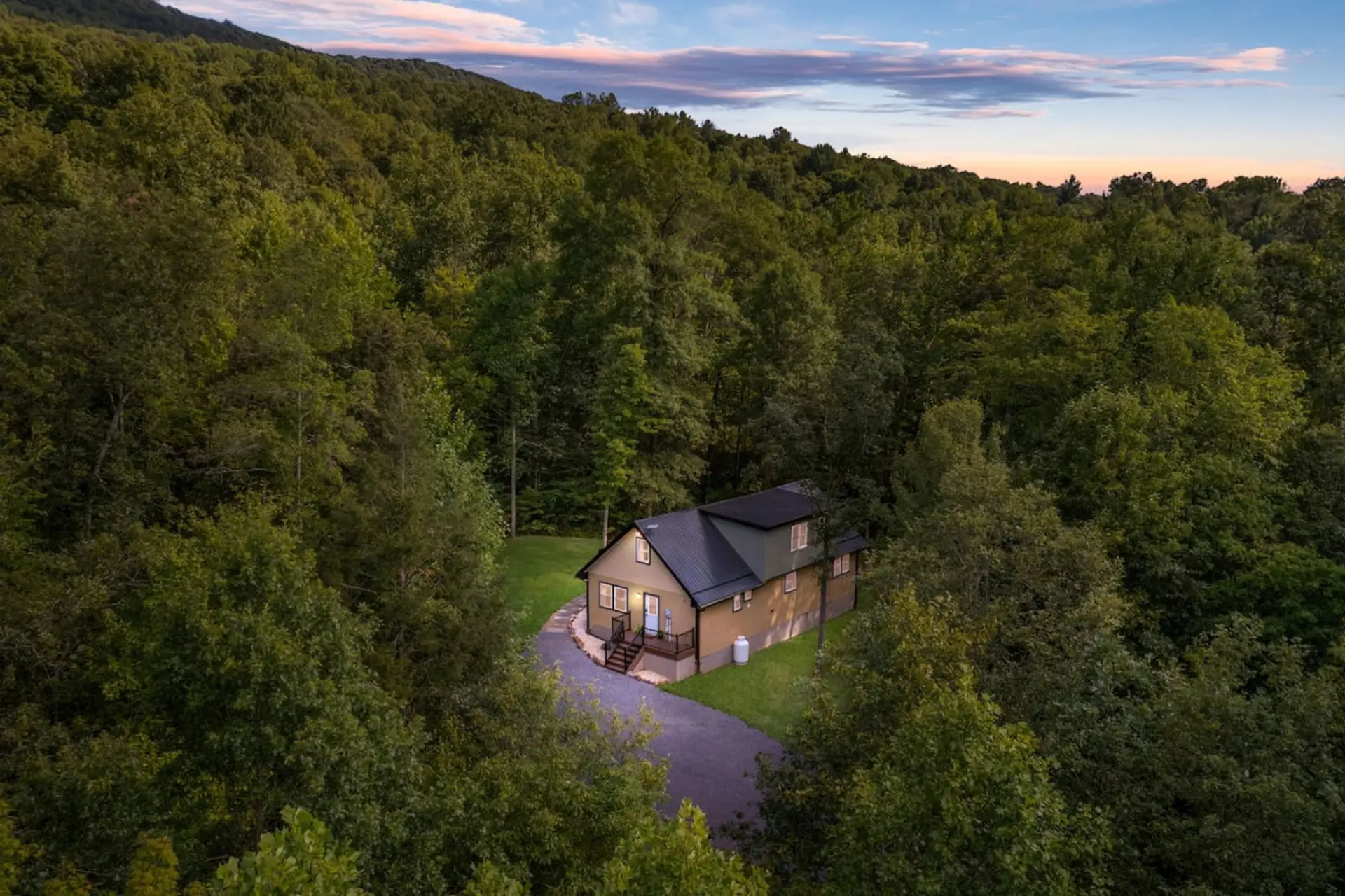Aerial view of the property with a driveway