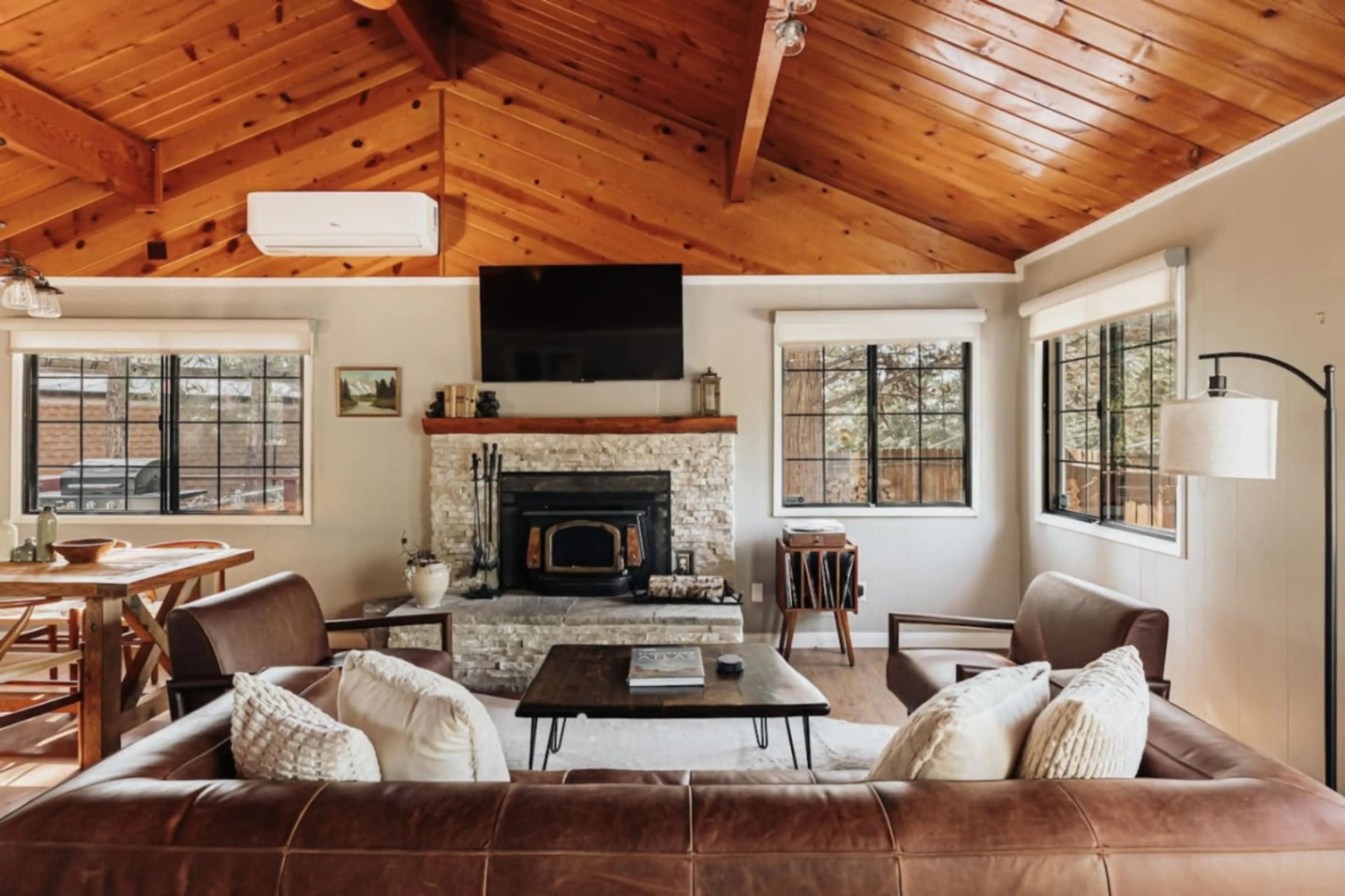 Living room features a wood burning fireplace.