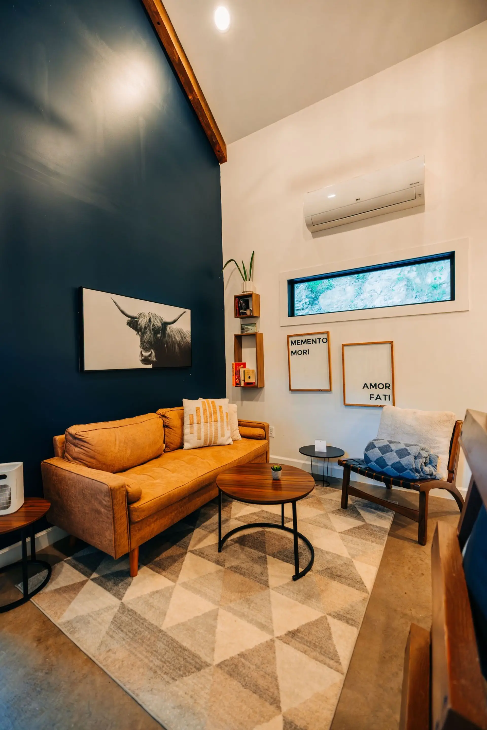 Unwind in the intimate sitting area with rustic charm, soft textures, and warm cabin style for couples