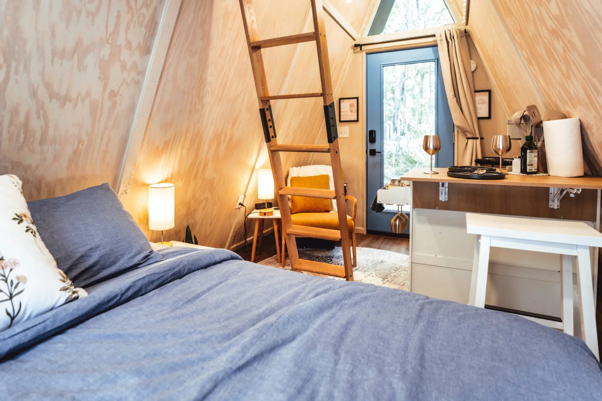 Cozy cabin interiors blend soft bedding, warm lighting, and rustic charm for an intimate couples retreat.