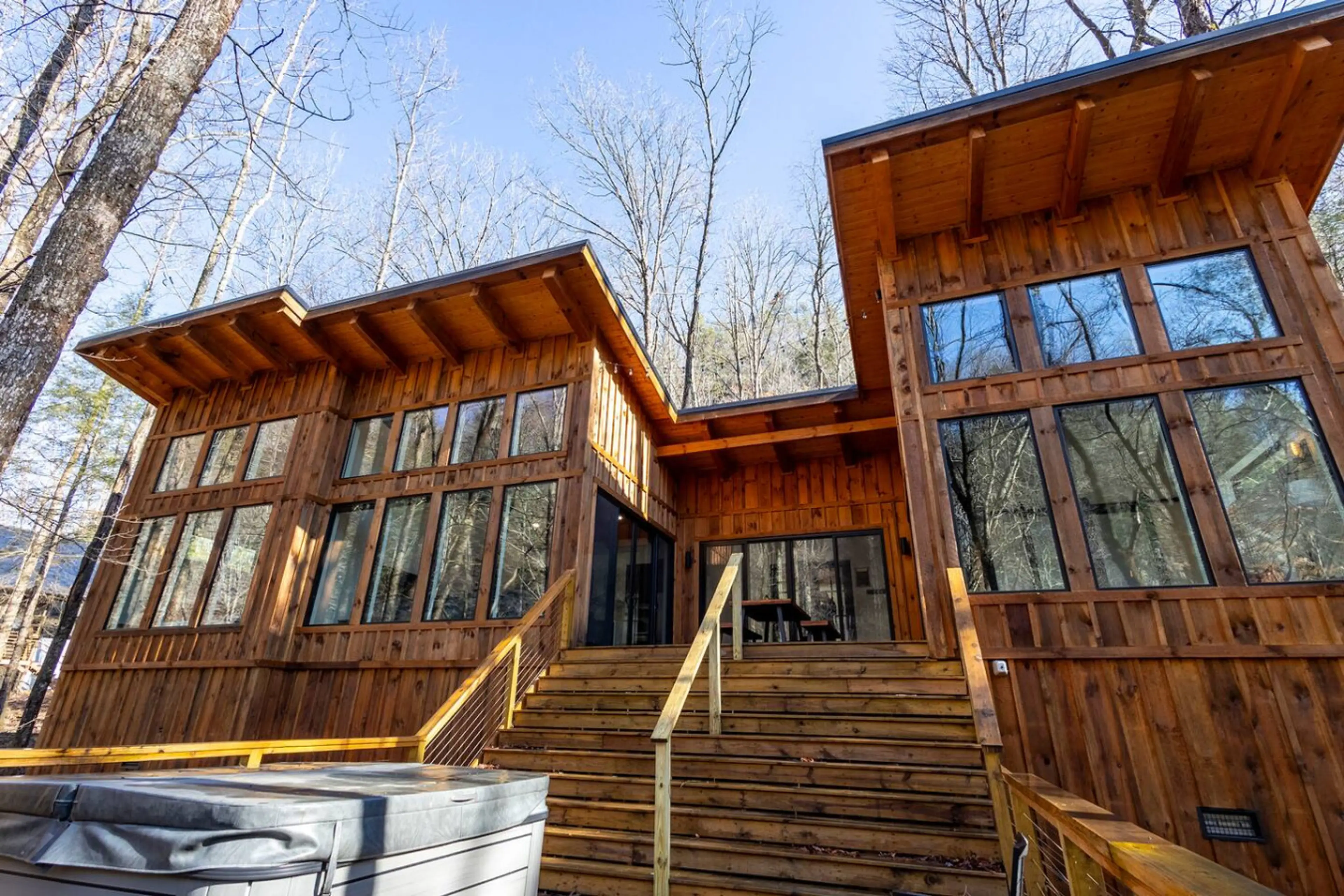 Welcome to Drop RED GORGEous by The Hideaways—a romantic Red River Gorge cabin with soaring windows, forest views, and a private hot tub perfect for stargazing together.