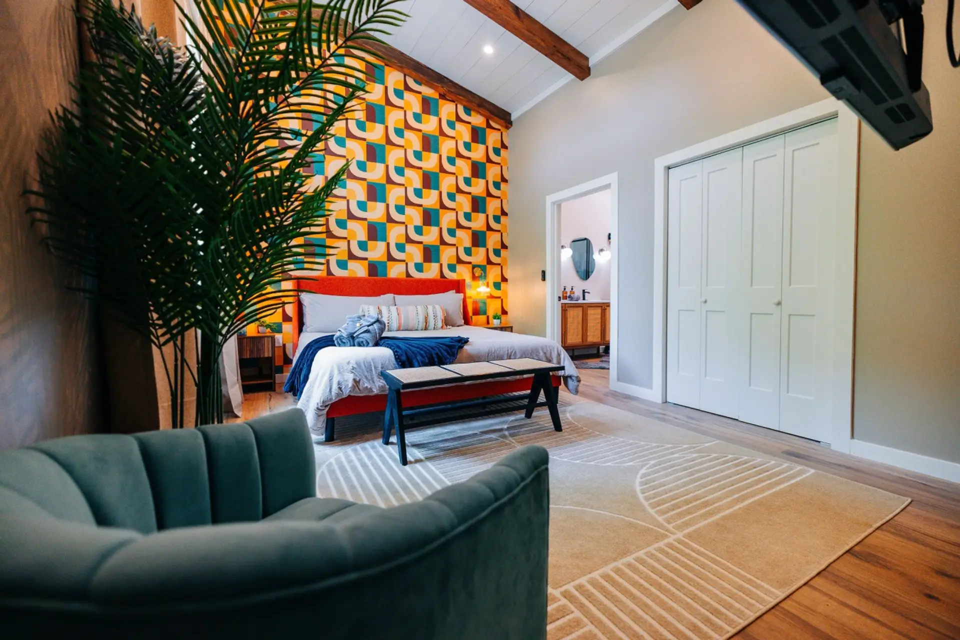 Bold bedroom with lounge seating and vibrant design, ideal for restful family cabin downtime after Gorge adventures