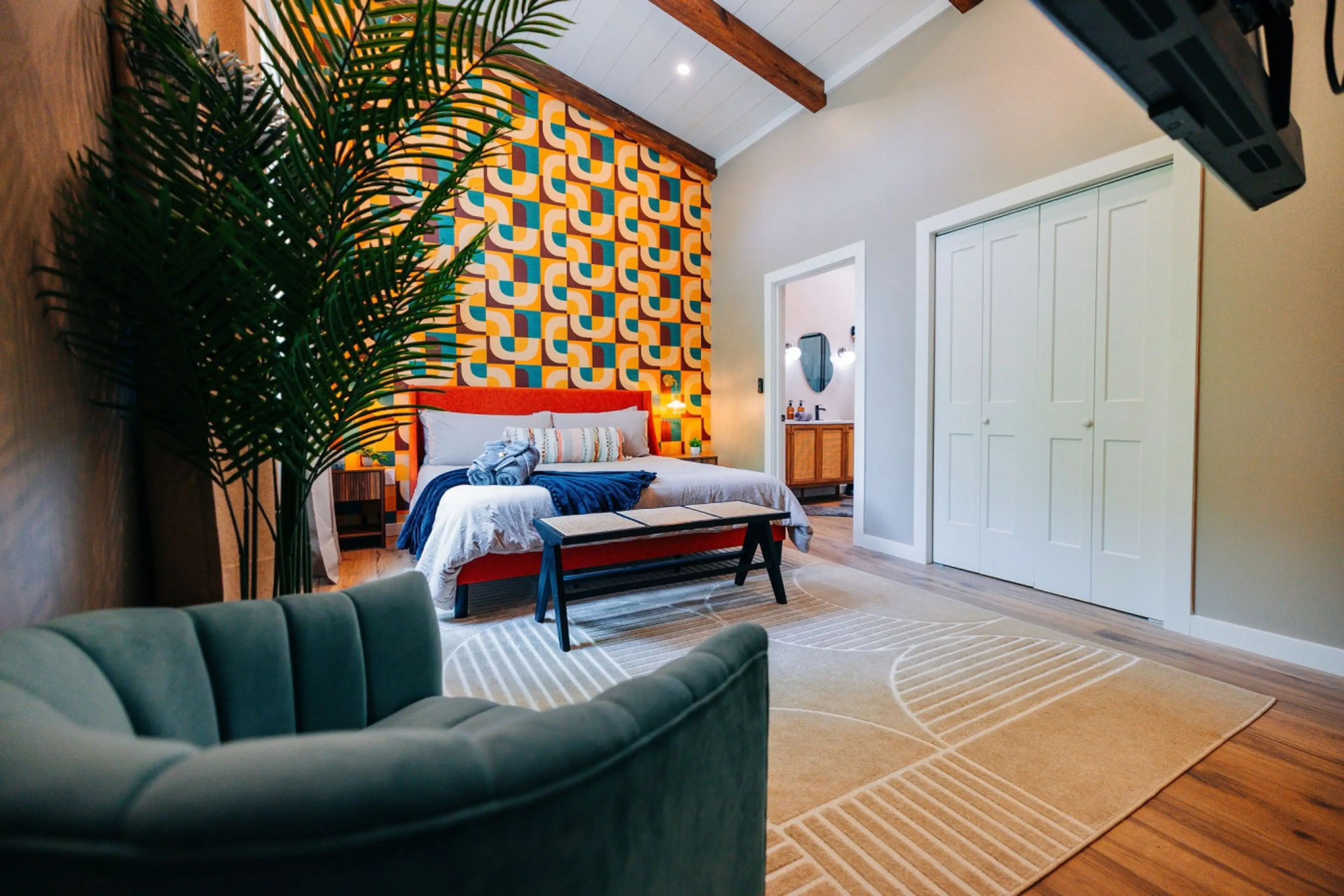 Bold bedroom with lounge seating and vibrant design, ideal for restful family cabin downtime after Gorge adventures