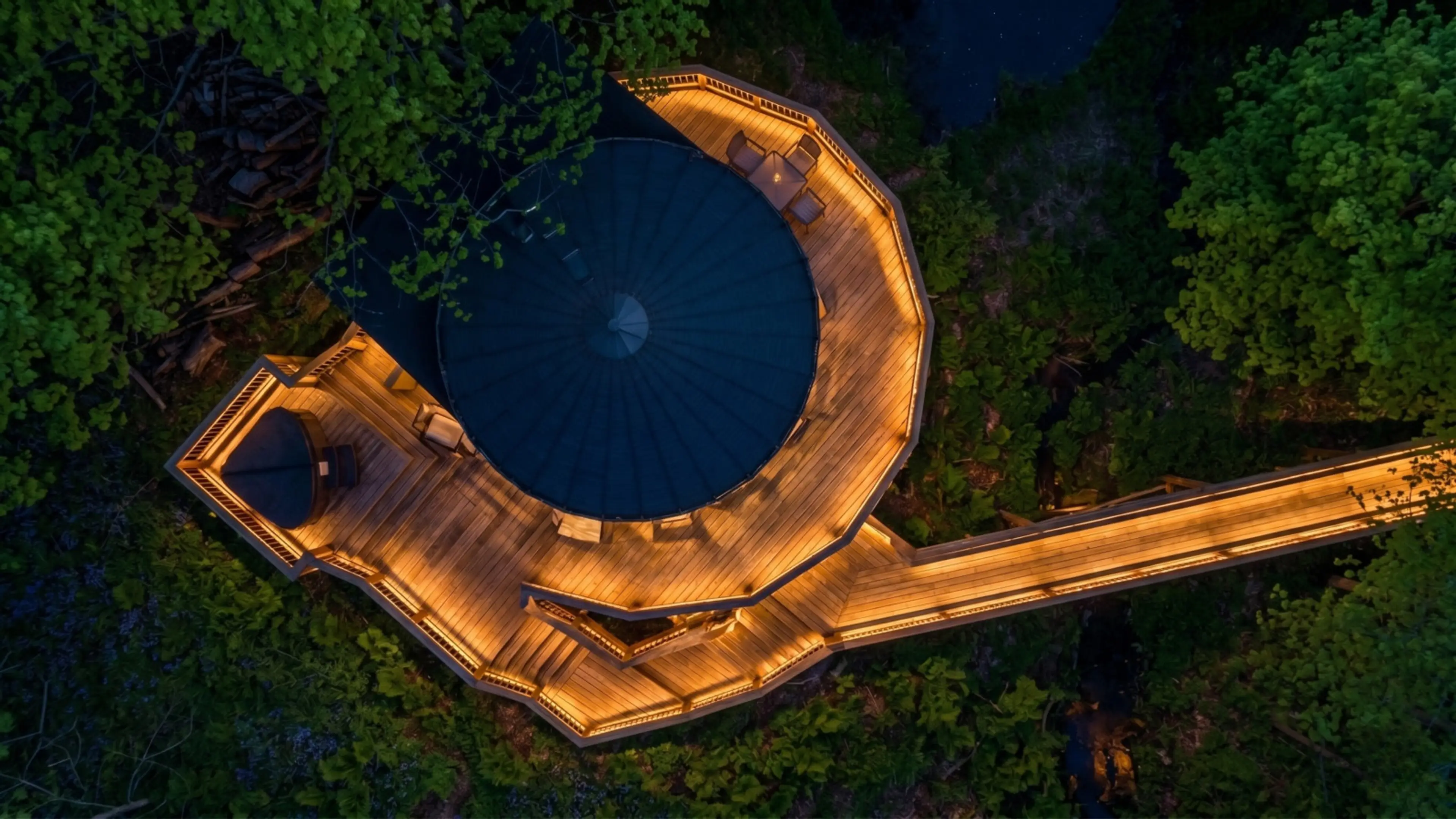 Cross the bridge to leave the world behind. From above, you can see just how tucked away and private your stay will be.