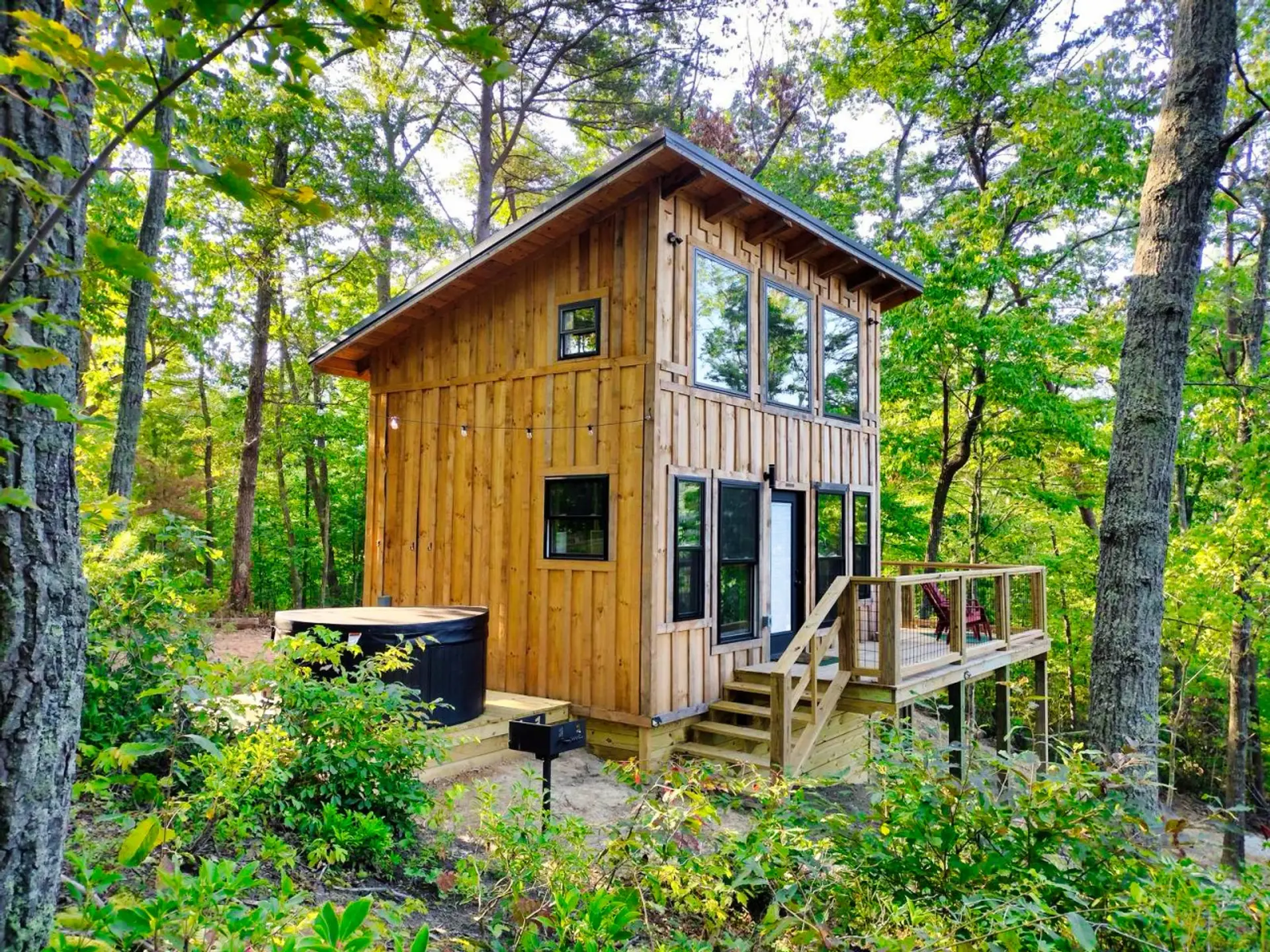 Your private treehouse cabin on a ridge in the Red River Gorge — pull in, drop the bags, and let fall begin.
