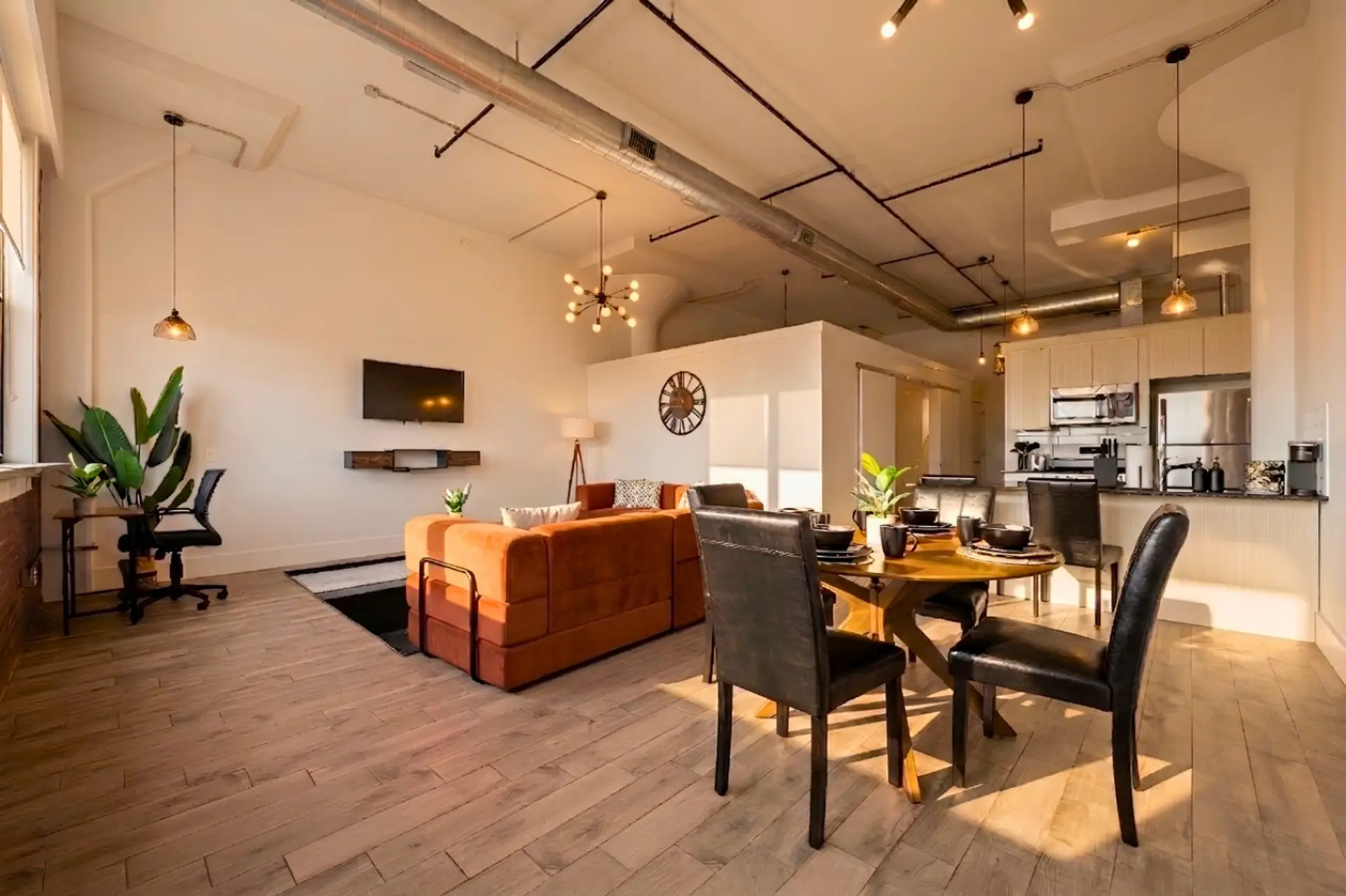 Picture sitting around a beautiful round table with four comfy leather chairs. It’s the perfect spot to eat meals, play games, or chat with family and friends.