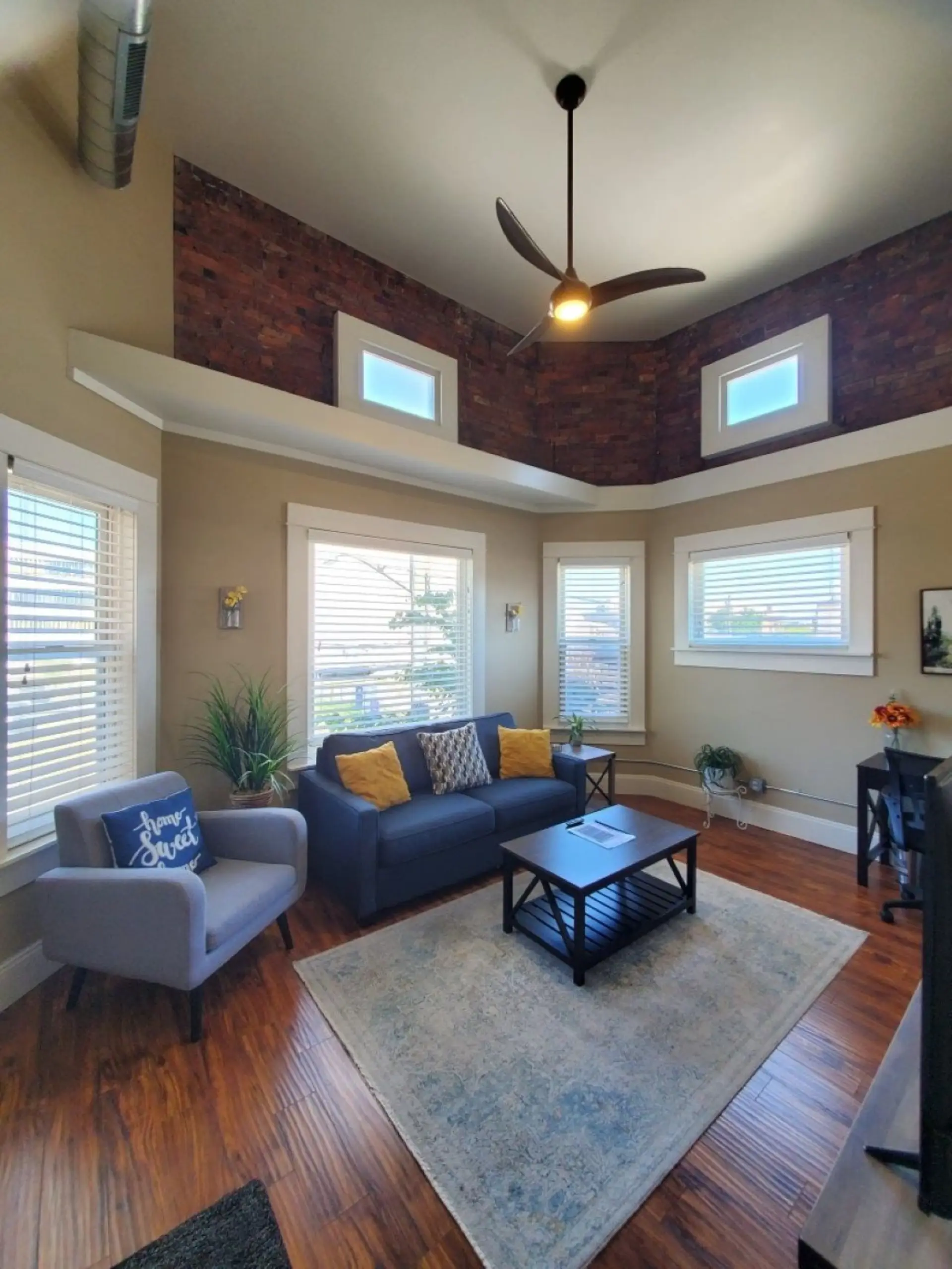 Living Room - Enjoy the sleeper sofa surrounded by vaulted ceilings, natural light and historic charm.